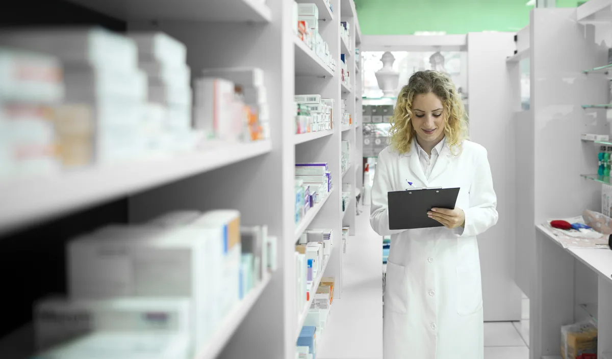 Pharmacist checking stock in a hospital pharmacy store