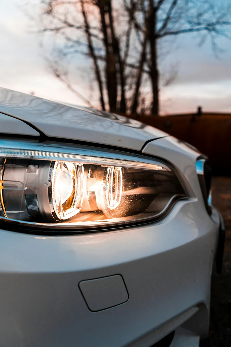 HyperAuto Care Headlight Restoration service process in a professional auto care workshop