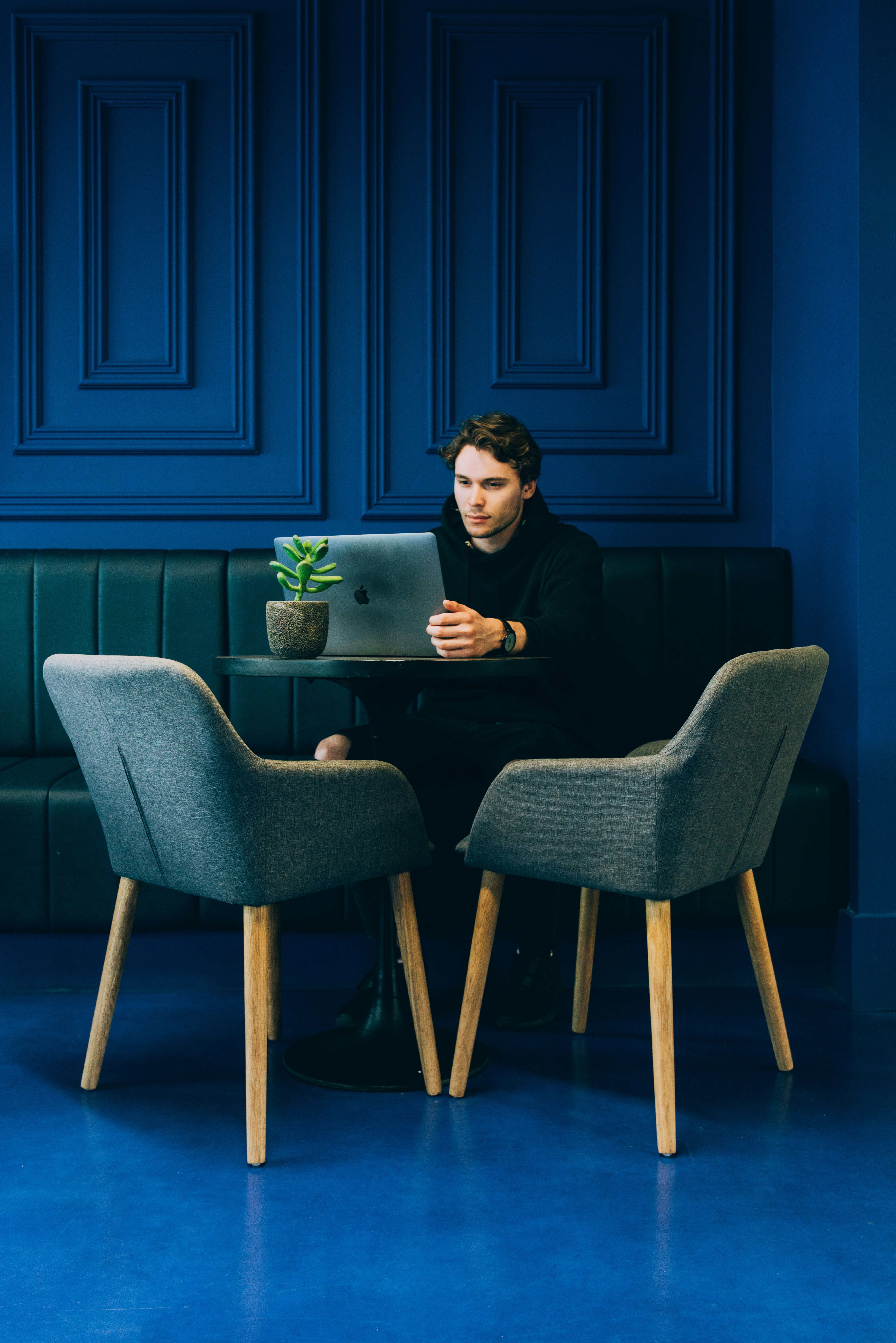 young man in blue room