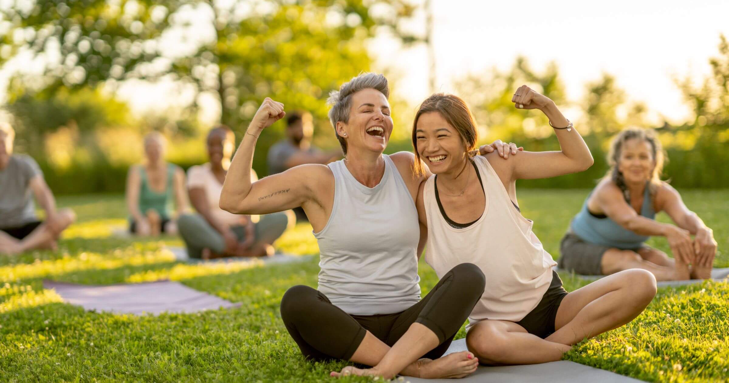 women in an outdoors workout class
