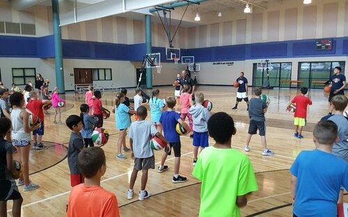 a group of children training in the court to build skills and self control