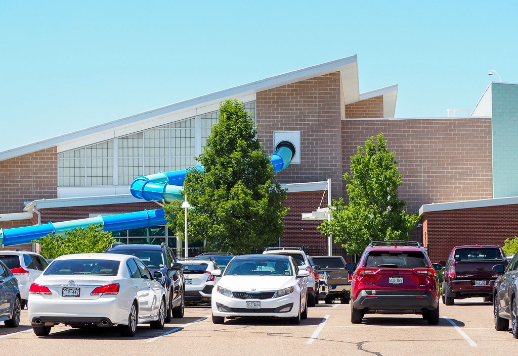 Exterior of Windsor recreational center with waterslide visible.