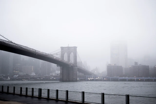 Brooklyn Bridge and the waterfront in fog