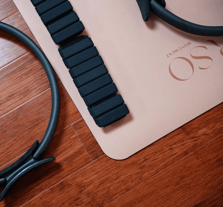 Close-up of mat, used for mat pilates, alogn with props for creative pilates and hot pilates workouts in west-end Toronto