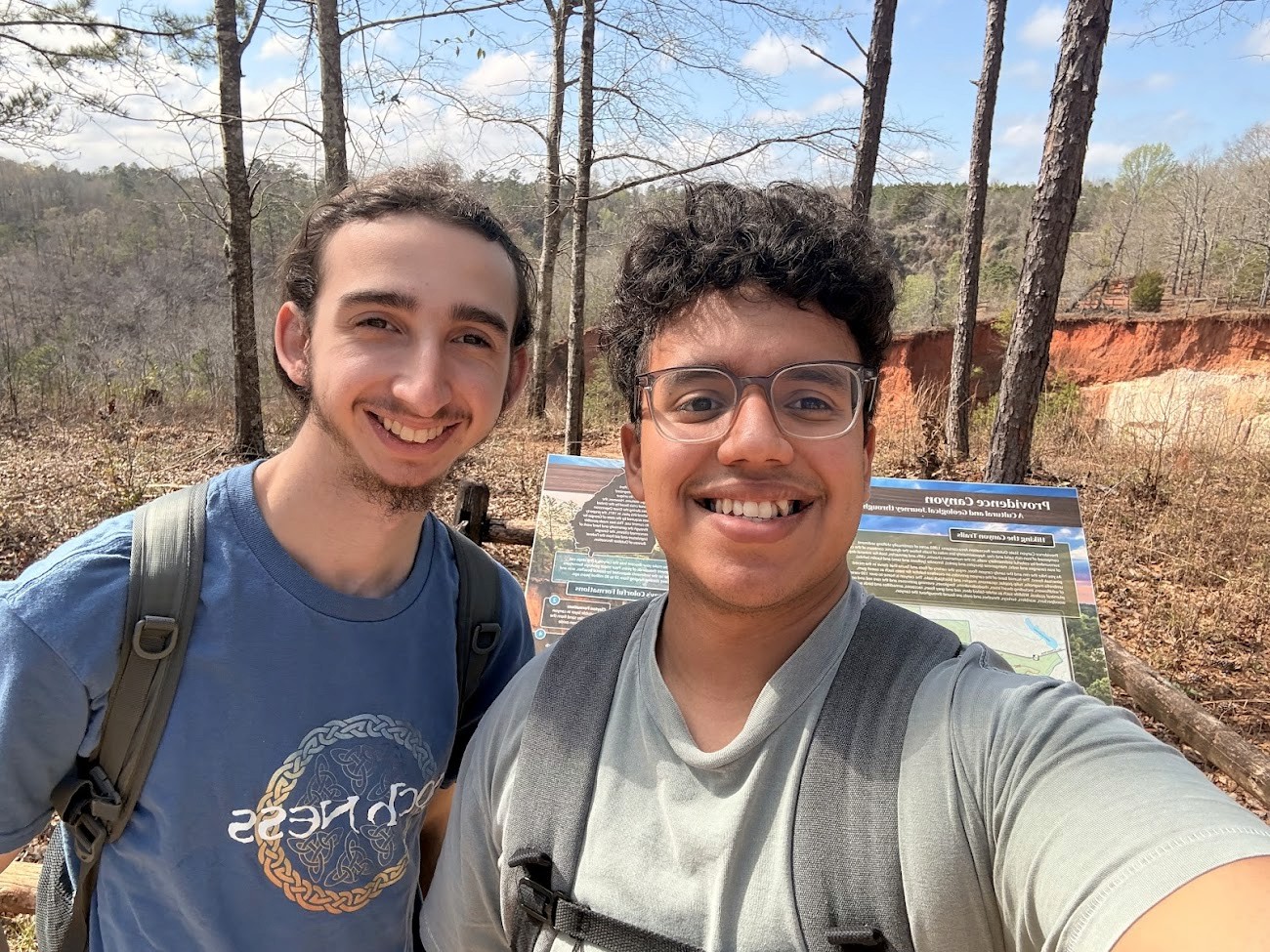 Vintage record player with blue vinyl, New Yorker poster, and ski poster.