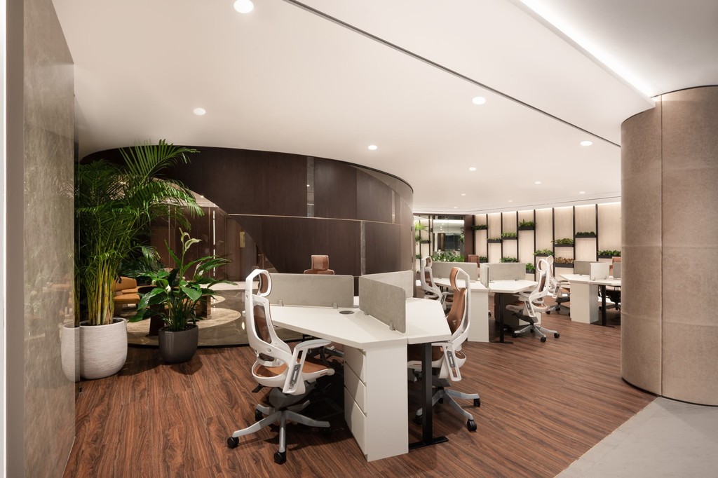 Minimalist yet elegant boardroom with a high-tech screen, ideal for team discussions and presentations.