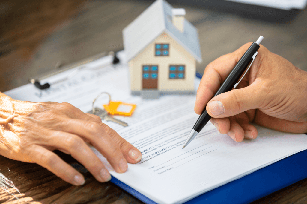 Real Estate Agent Helping Client In Filling Contract Form