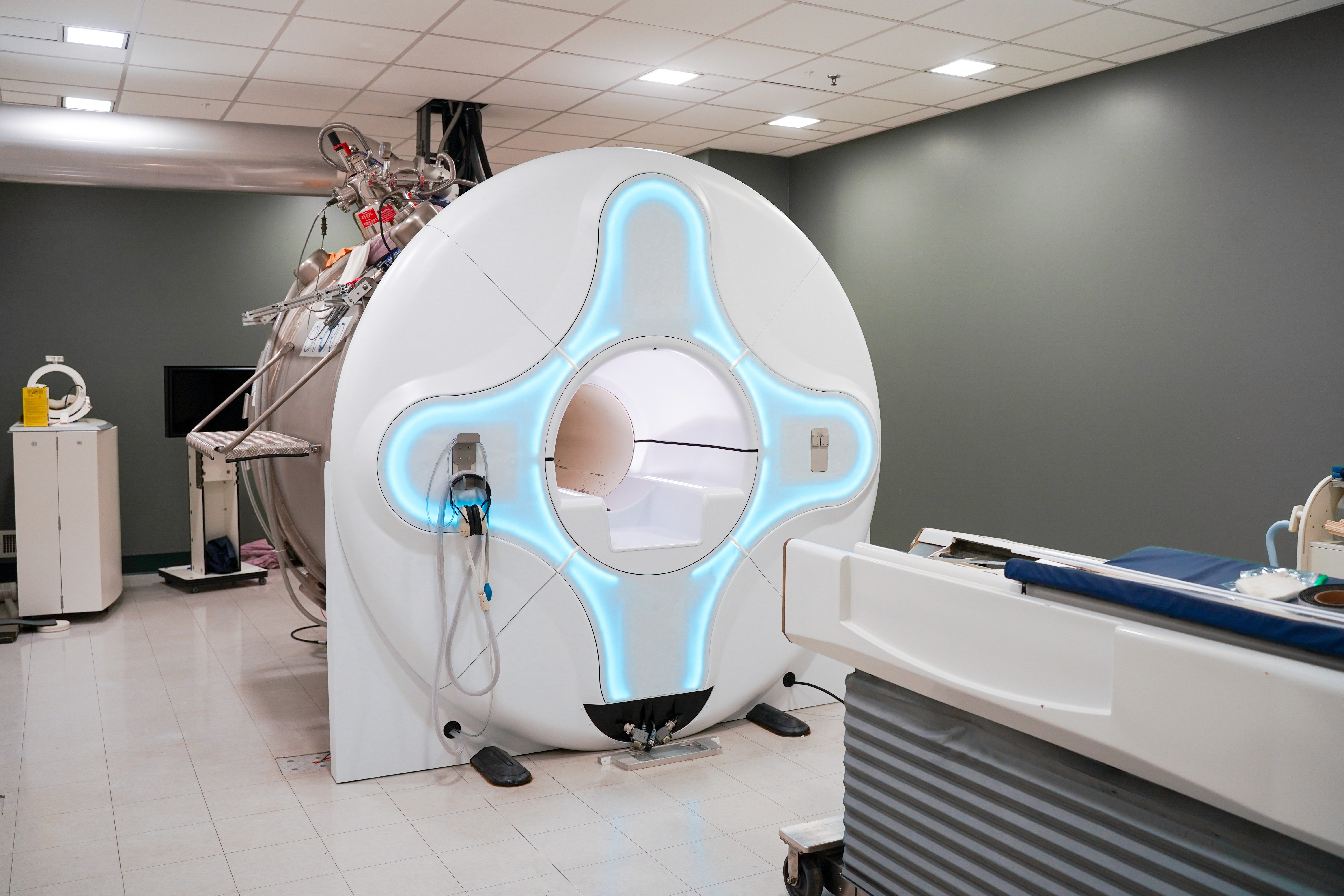 a wide shot of a MRI machine in a medical room