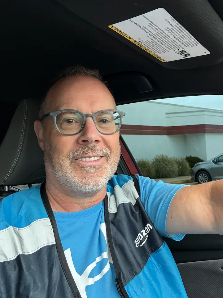 Stu with Amazon vest on driving for Amazon Flex.