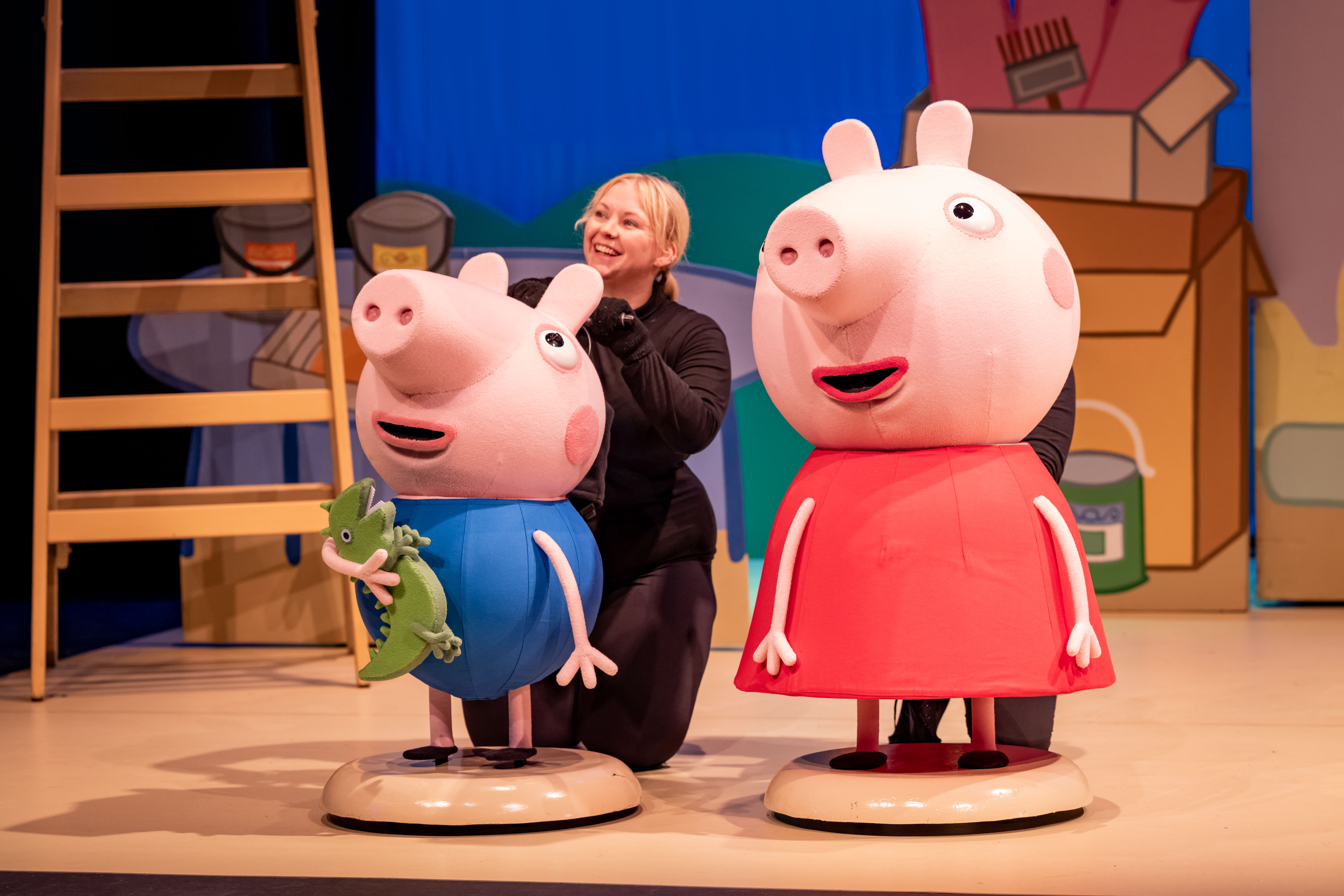 George and Peppa Pig characters onstage in Peppa Pig’s Big Family Show.