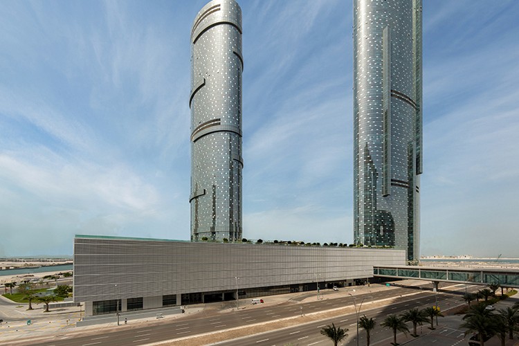 Modern Sky Tower exterior with glass facade, showcasing premium real estate agent listings in a high-rise building.