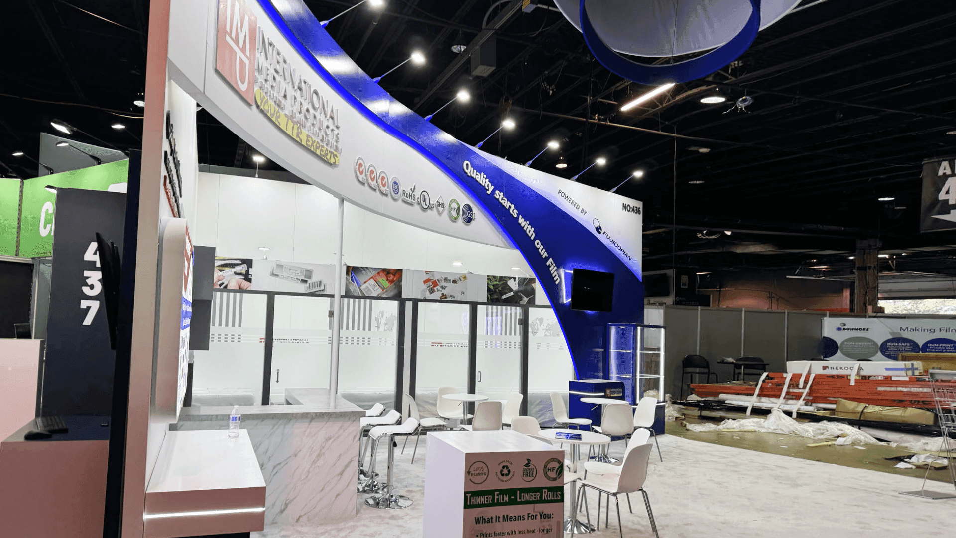 LOUPE Americas label printing booth with press demo and sample review area