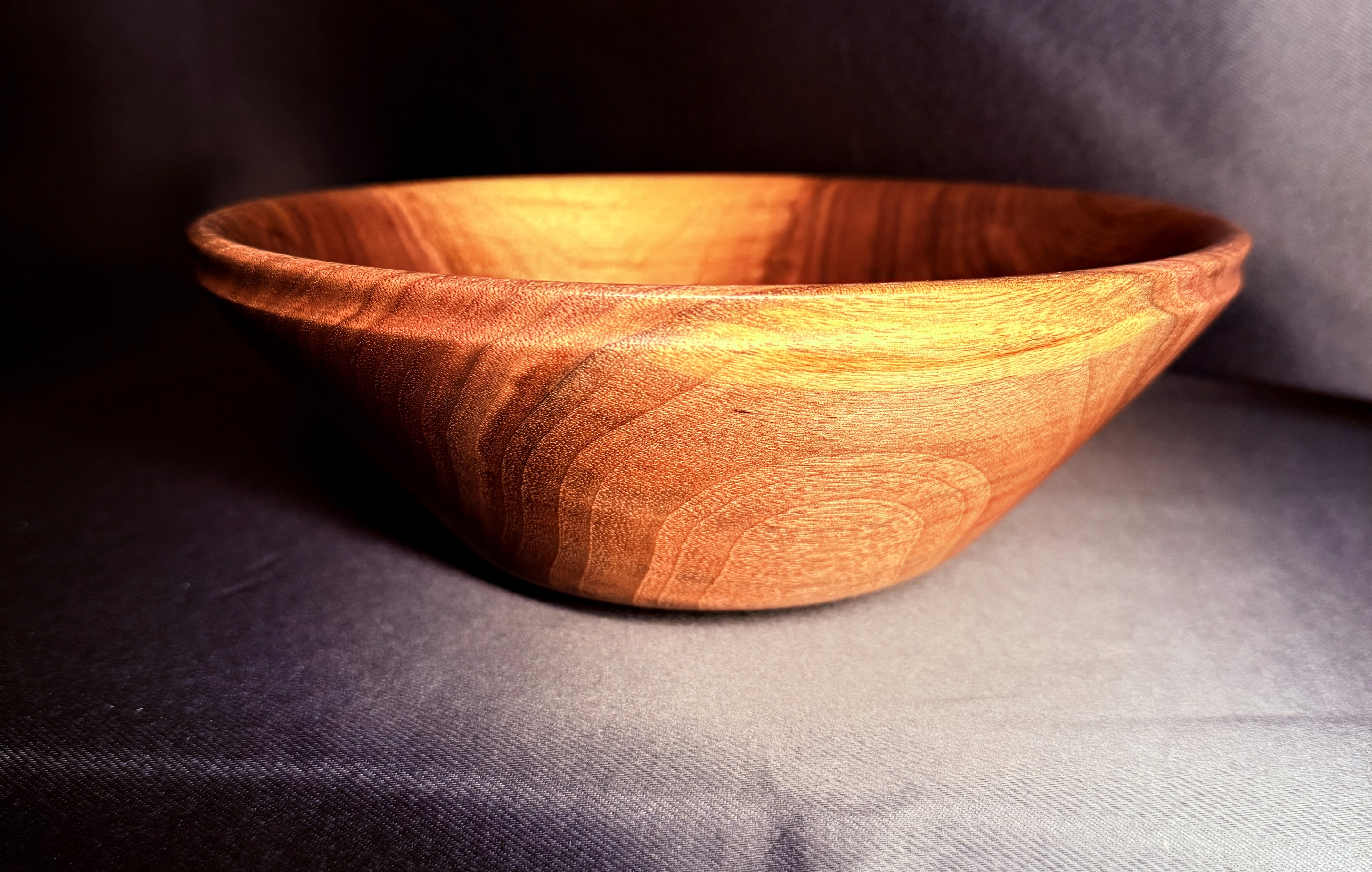Detail of the glossy finish and walnut grain on the Bullseye Walnut Bowl.