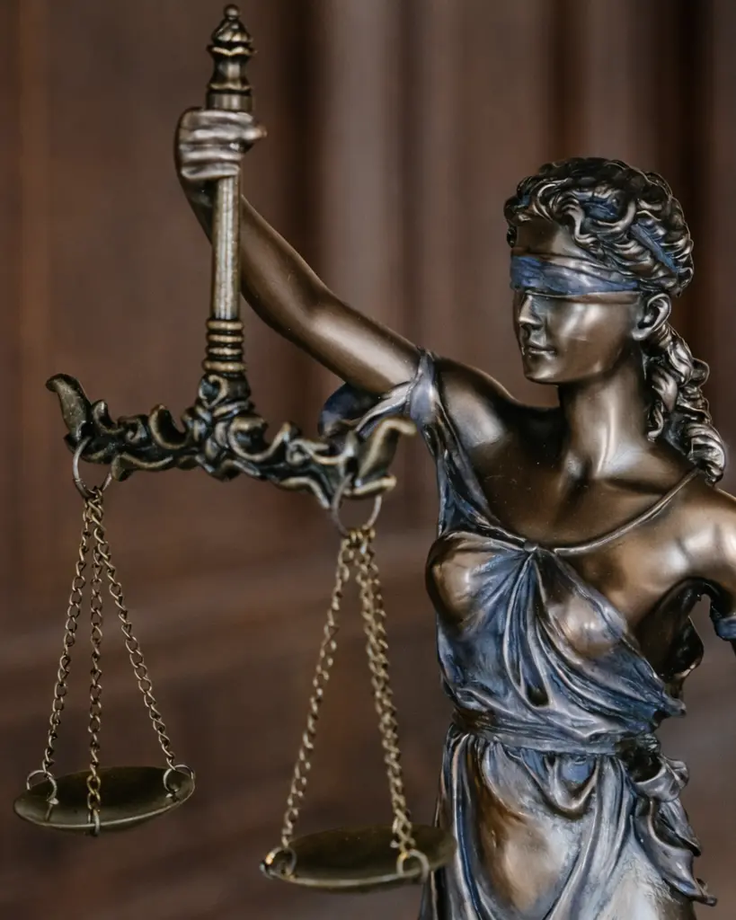Lady Justice statue with blindfold and scales of justice