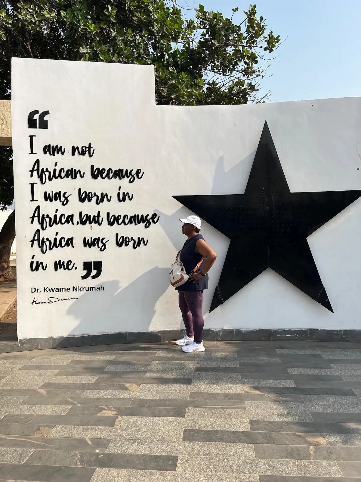 A visitor reflects at the Kwame Nkrumah Memorial Park.