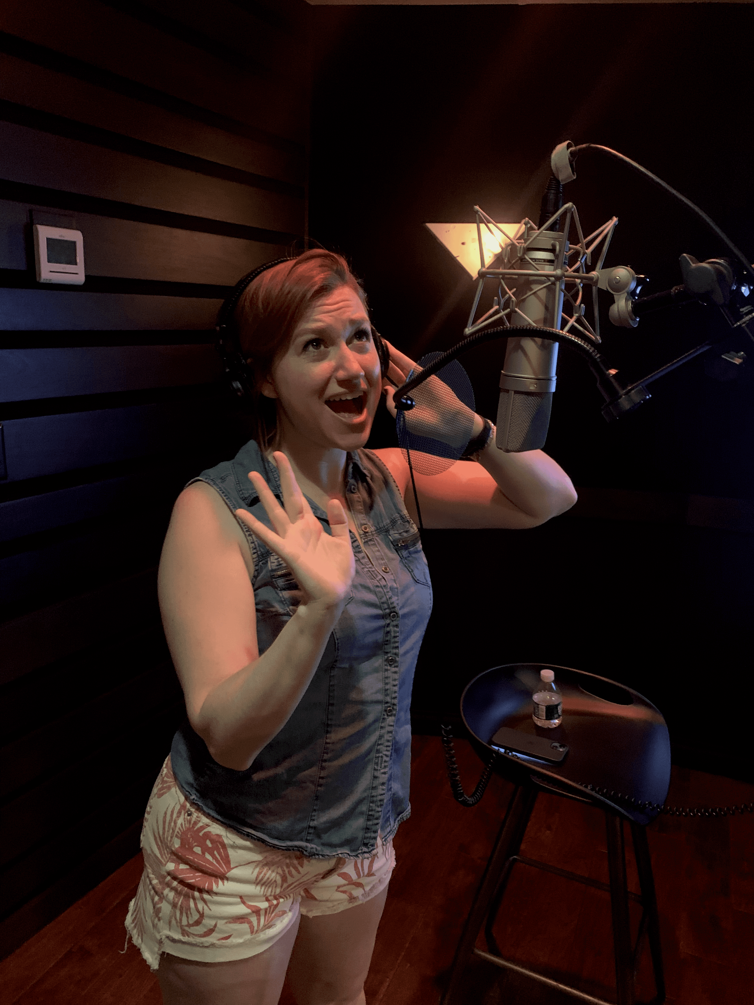 Host mid-take singing at the mic