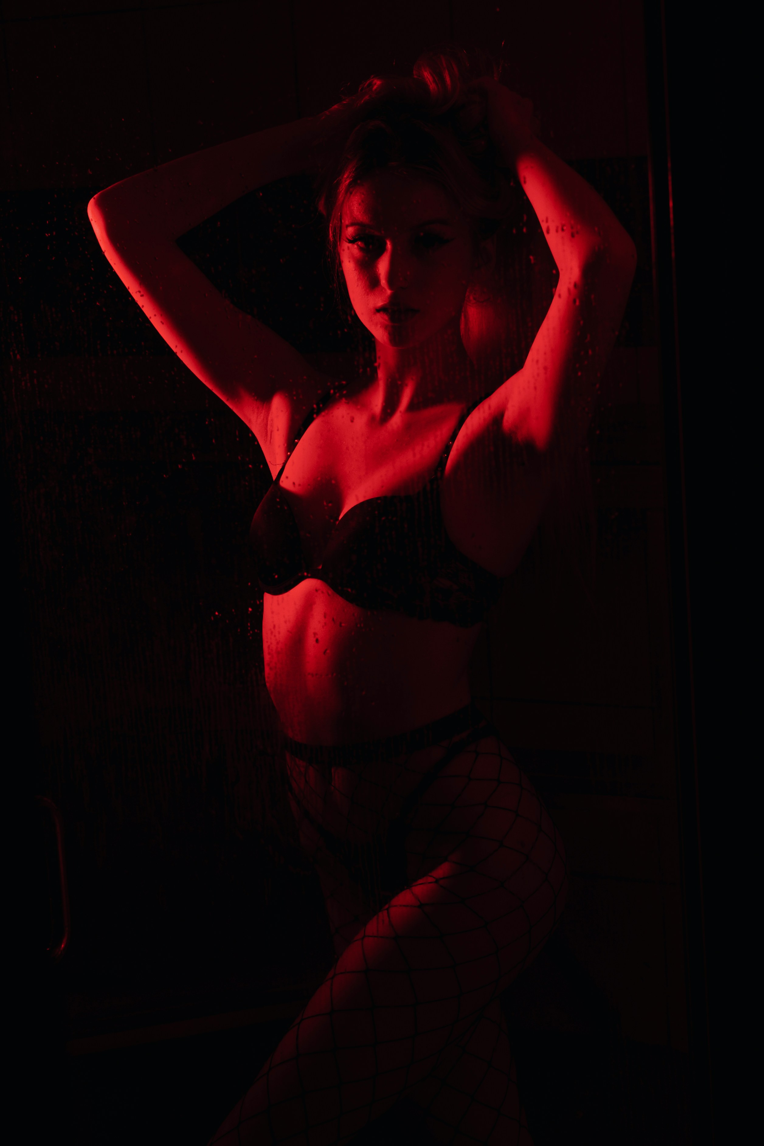 woman in black brassiere and white pants