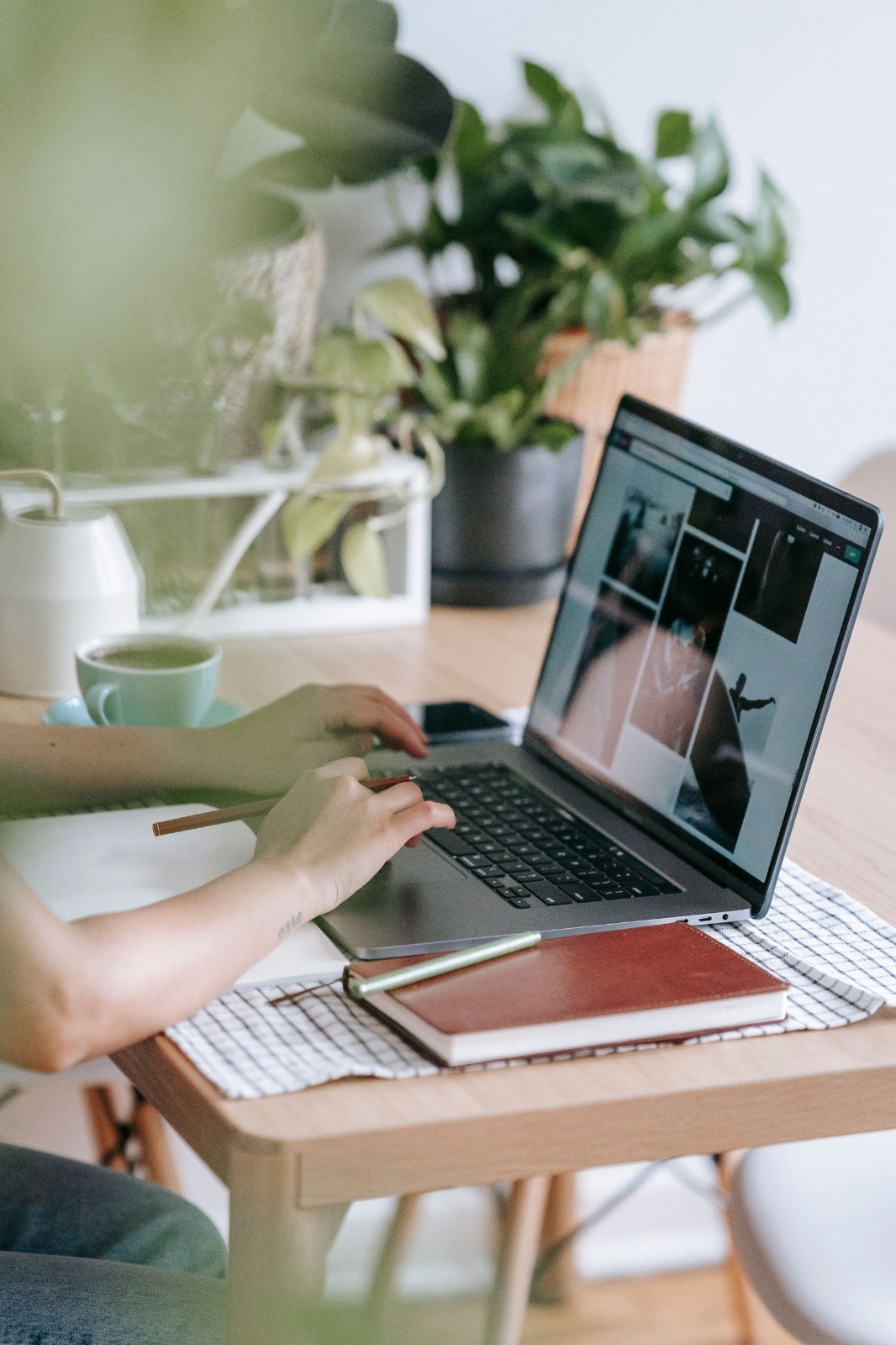 Image of a designer working on his computer