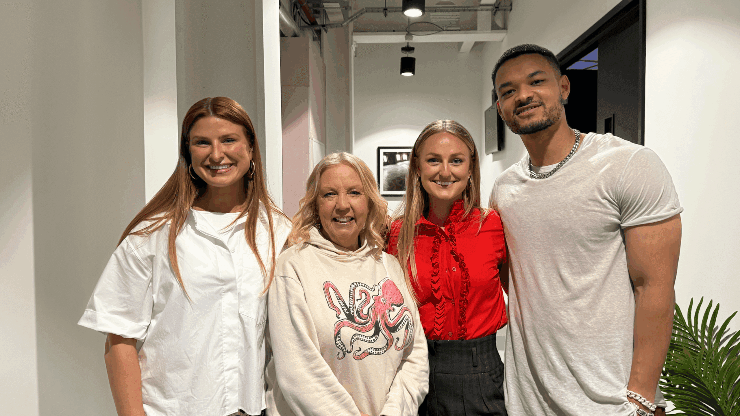 Four members of the ivee team standing together after filming