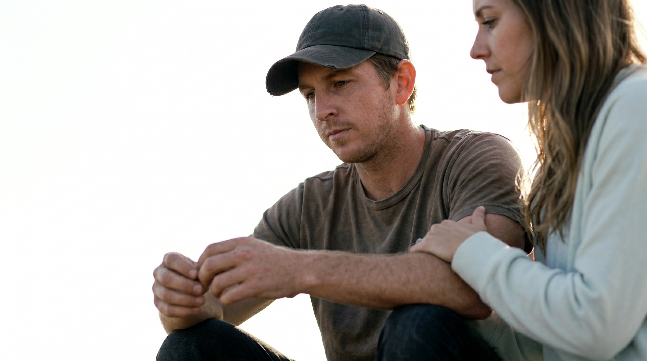 Man discussing voluntary substance use disorder support with his partner before seeking help through JWHope