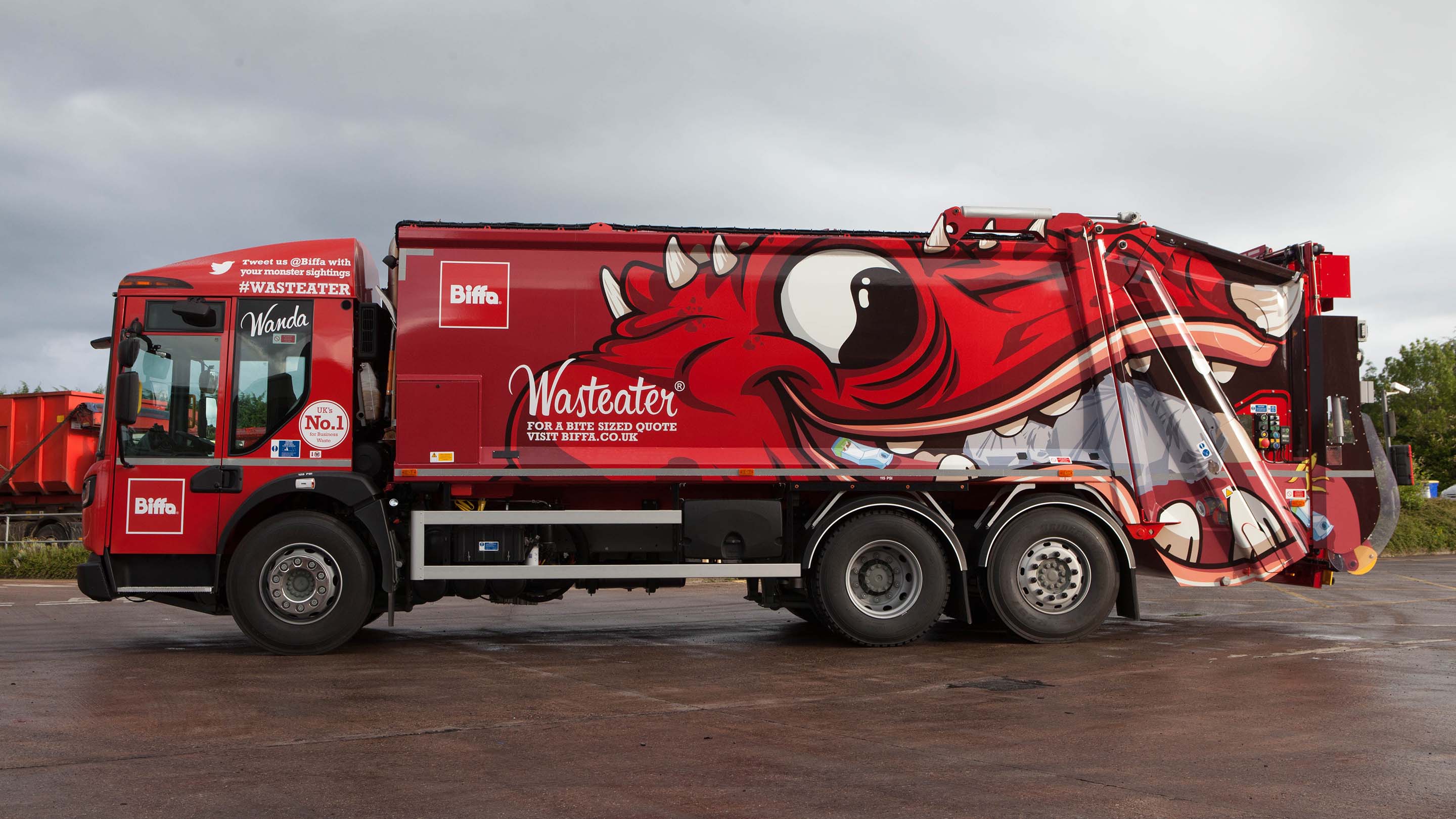 Side image of a Biffa garbage truck with a illustrator of a monster on the side