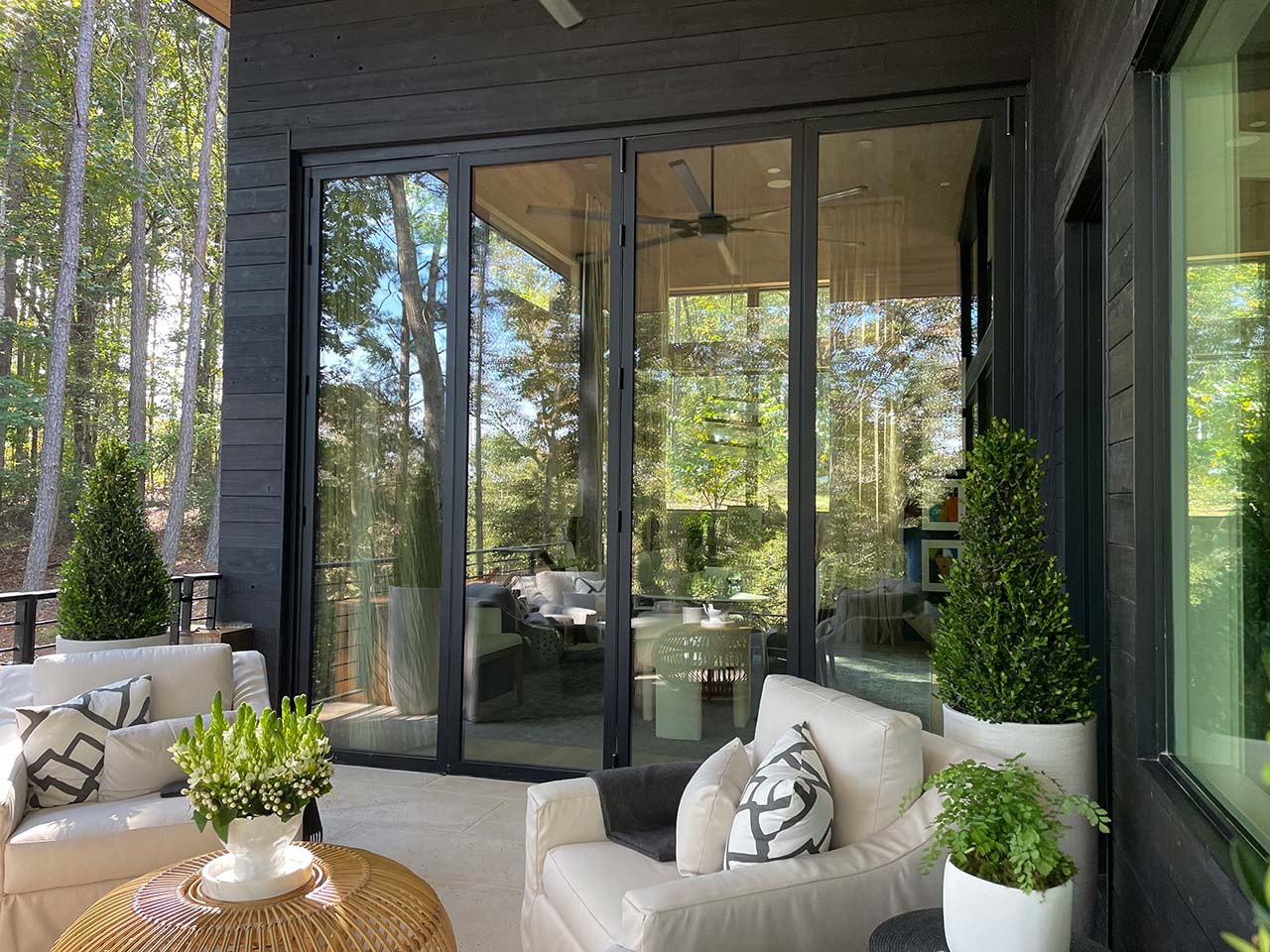 Large Windsor Pinnacle Series multi-slide patio door connecting a kitchen to an outdoor deck.