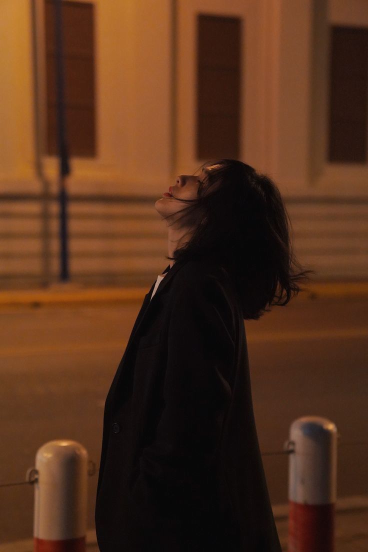 woman listening on black headphones