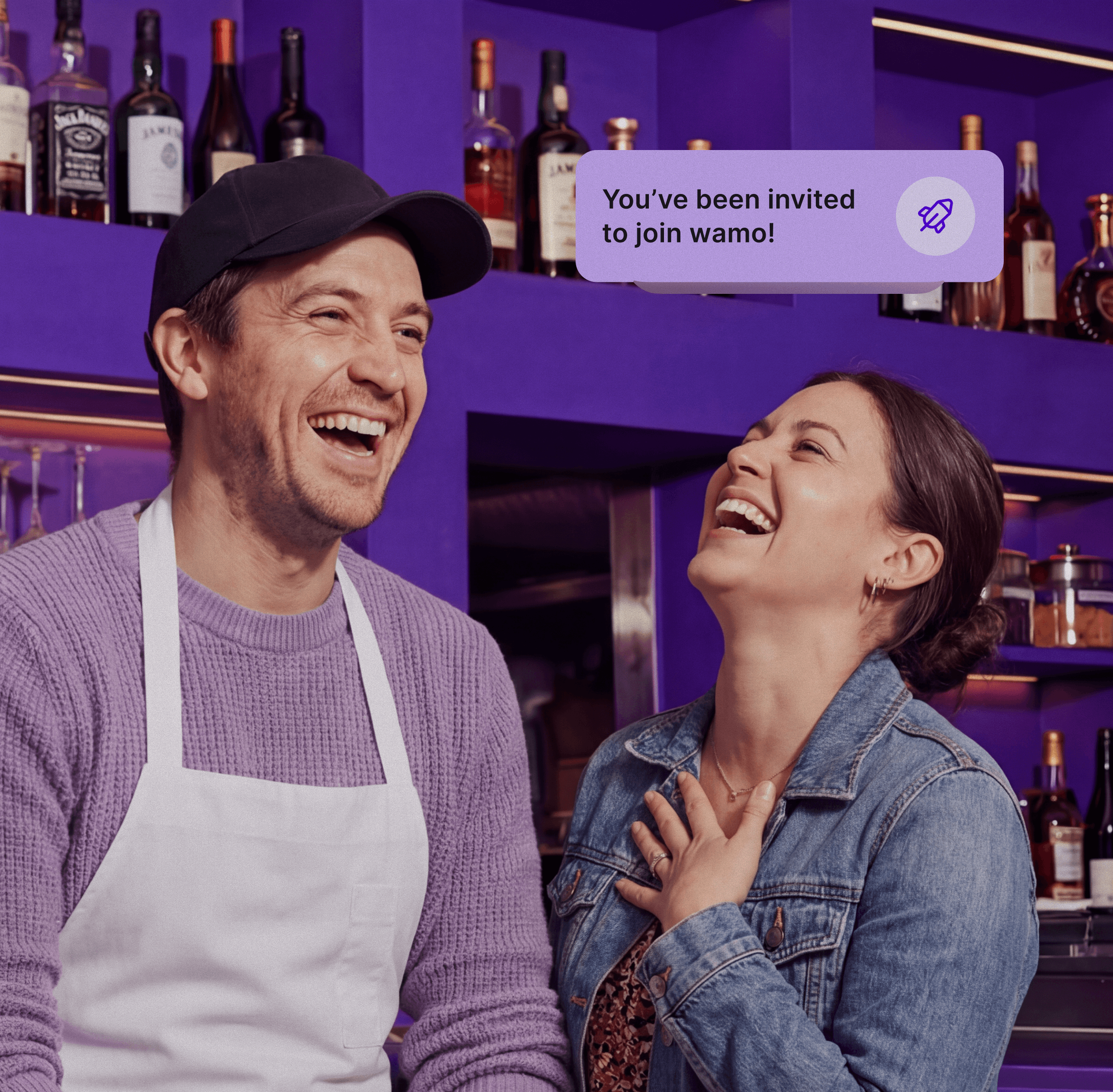 A desk with a laptop and an employee badge laying on top of it.