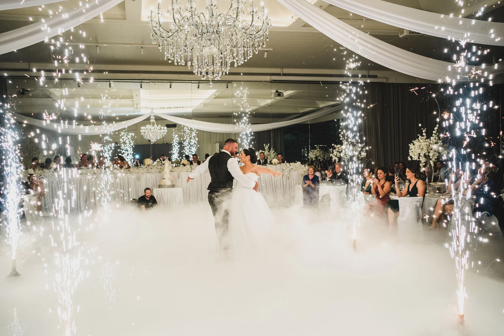 Bride and groom entrance with indoor sparklers at Melbourne ceremony
