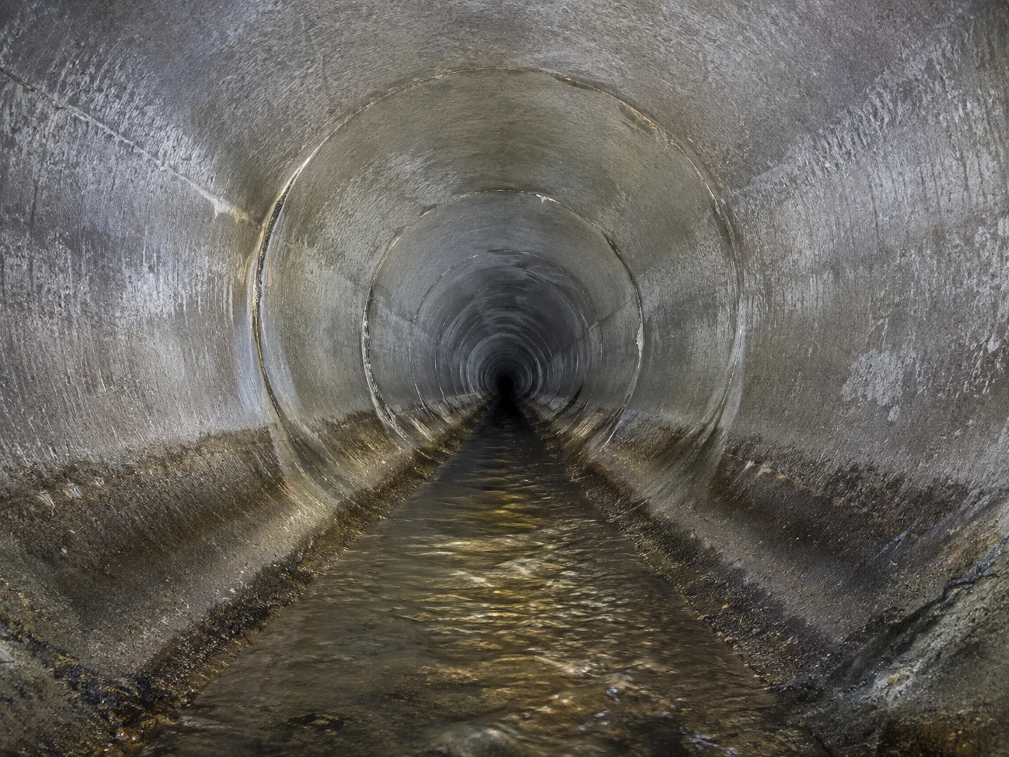 Collision-tolerant inspection drone flying inside a concrete culvert with integrated lighting