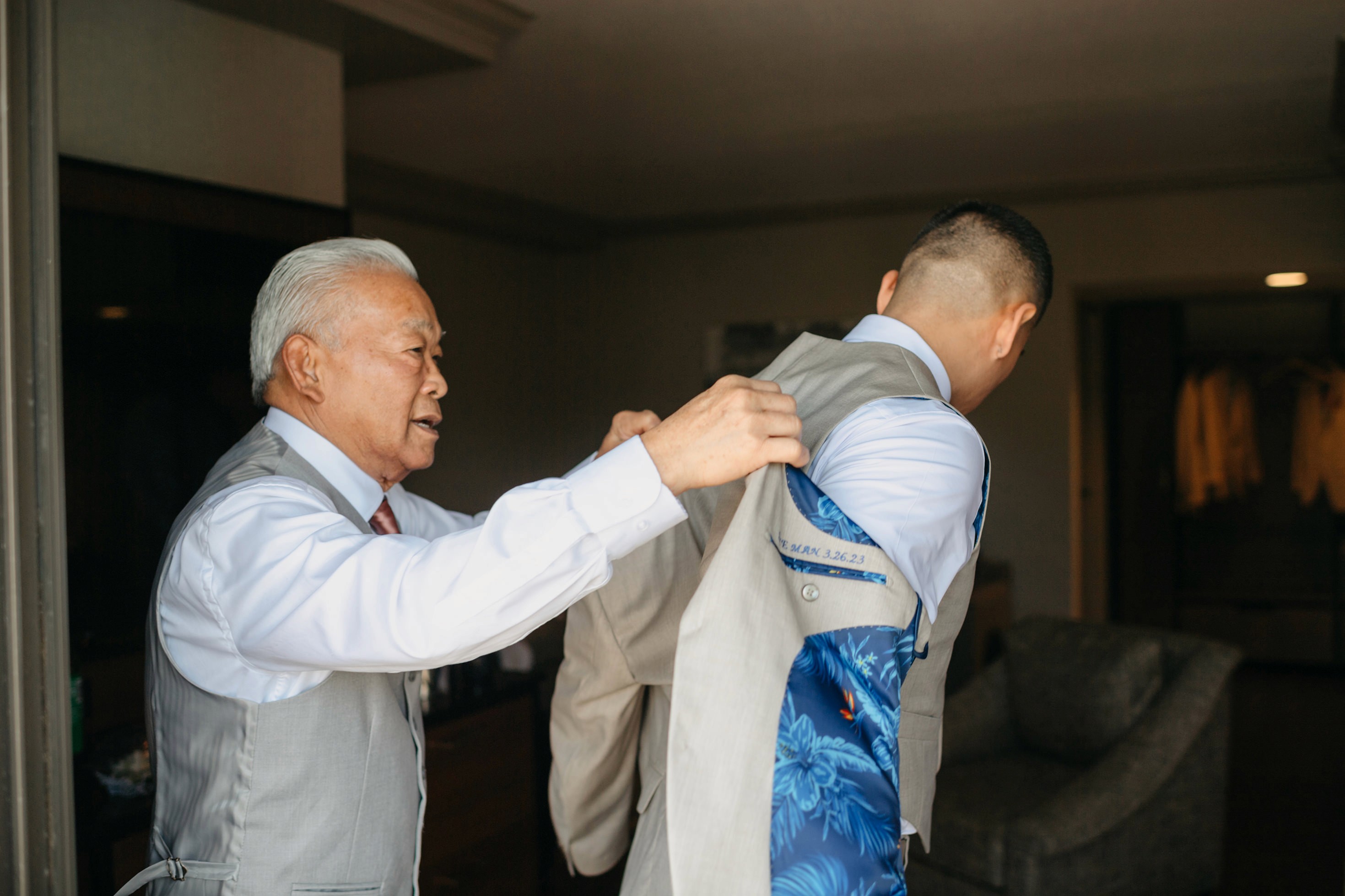 Flat lay wedding details with bouquet, rings, and sparkling bridal heels