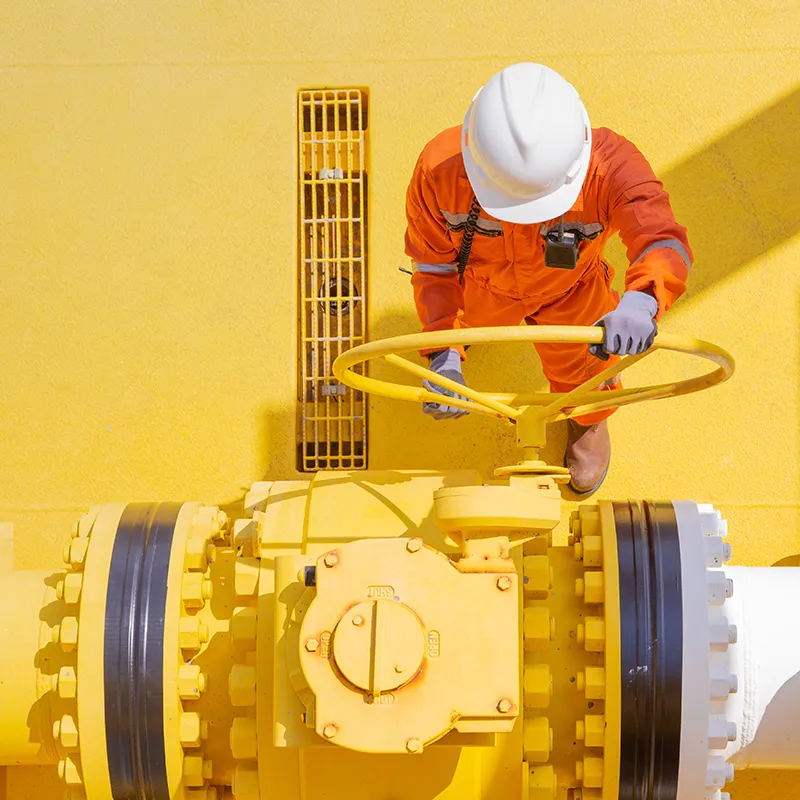 Top angle of a man operating yellow machinery