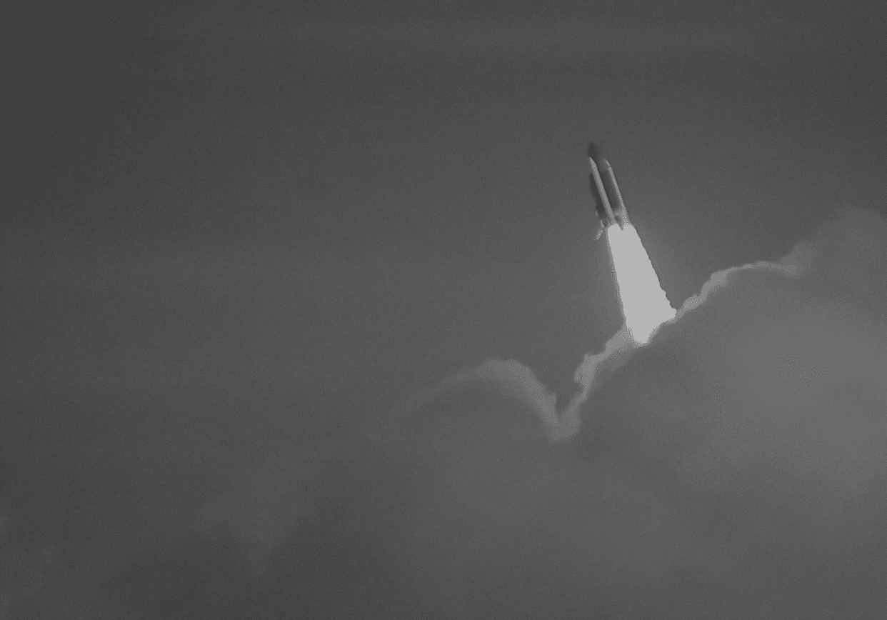low-angle photography of red space shuttle