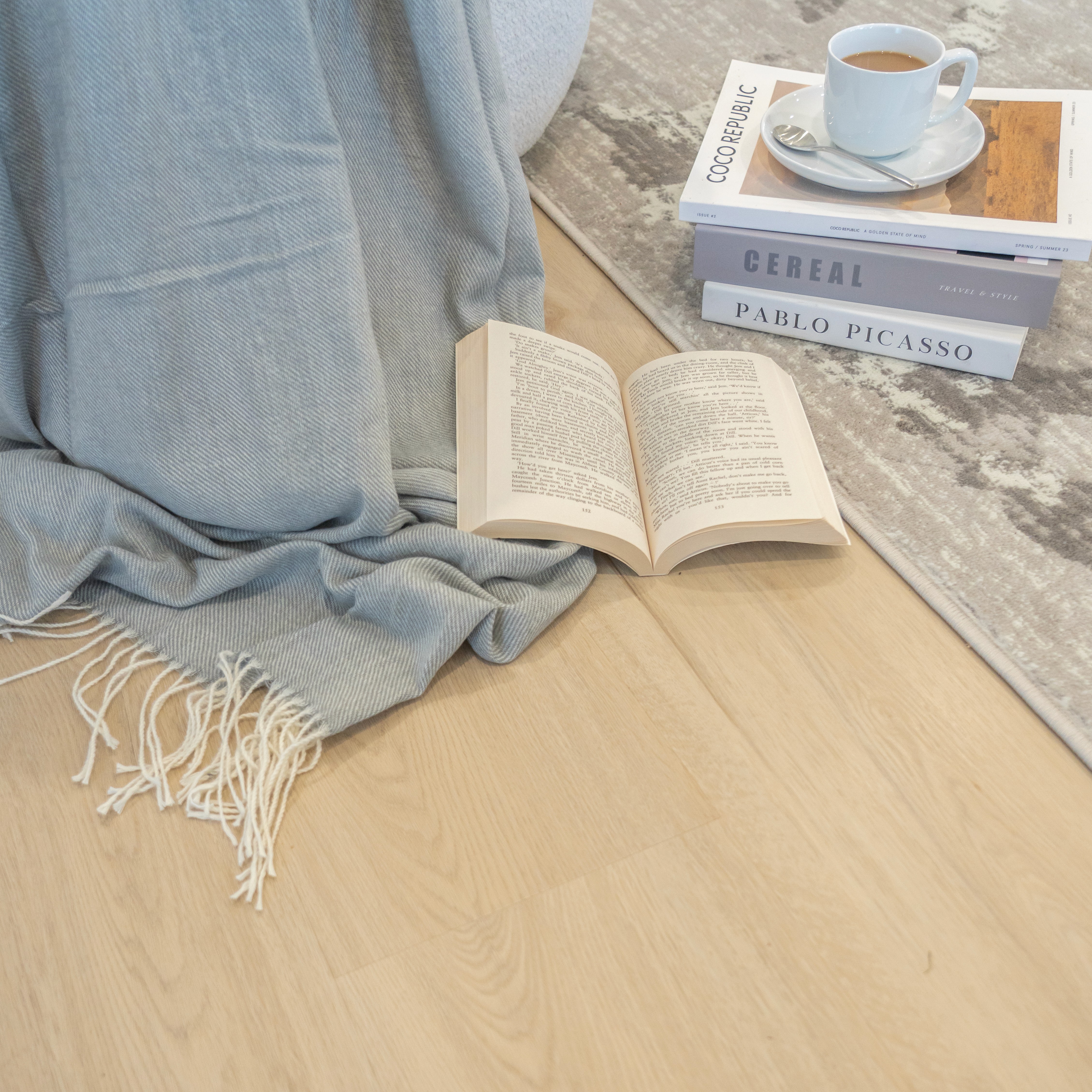 Light oak hybrid flooring in a Brisbane living room, water-resistant and easy to wipe clean after coffee spills or everyday mess.