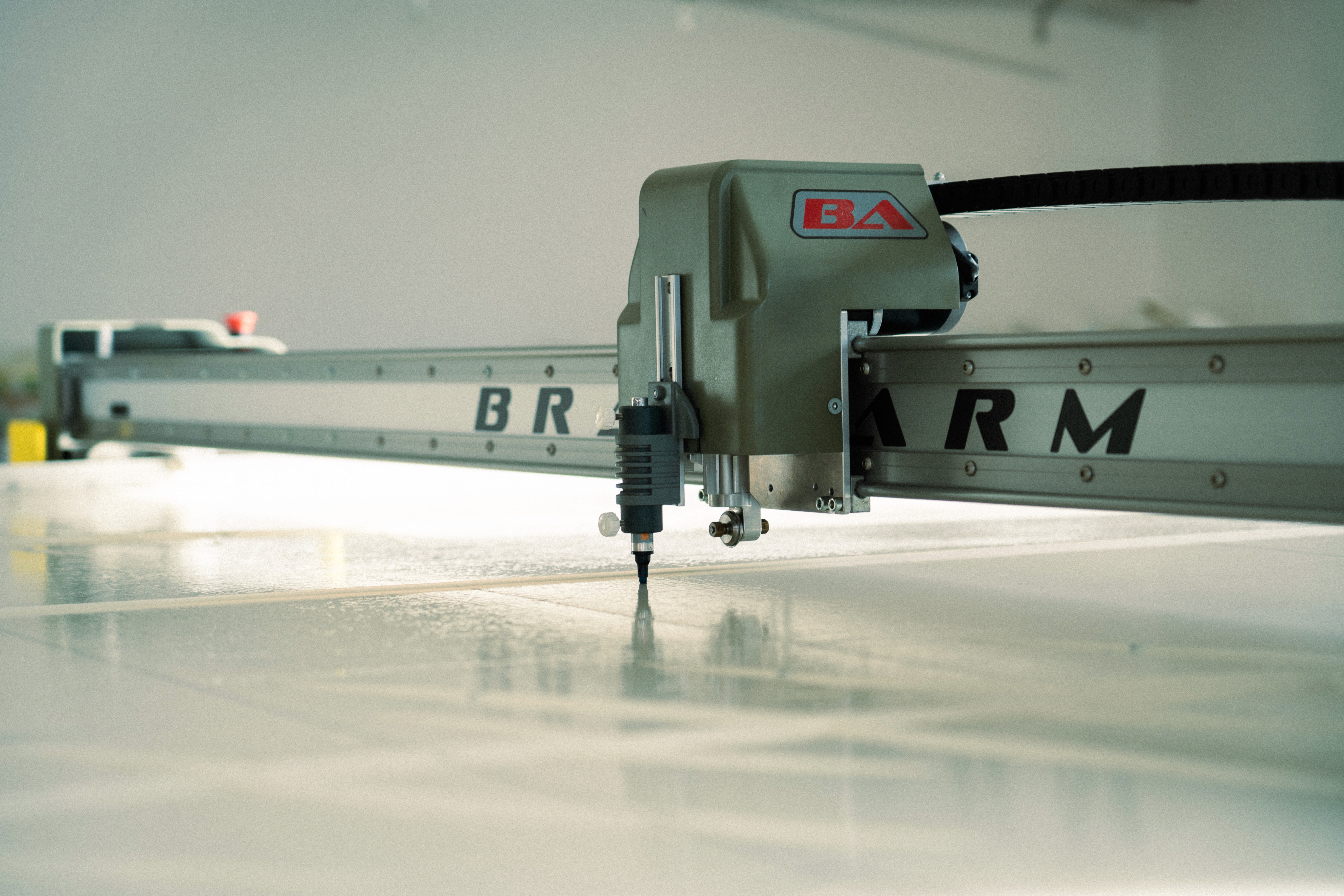 a photo of a cutting machine for fabrics