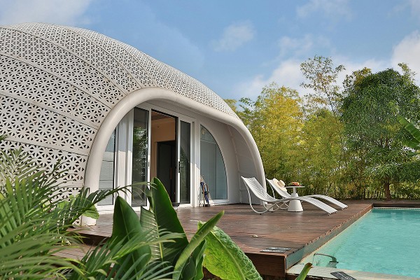 House with pool and curved design.