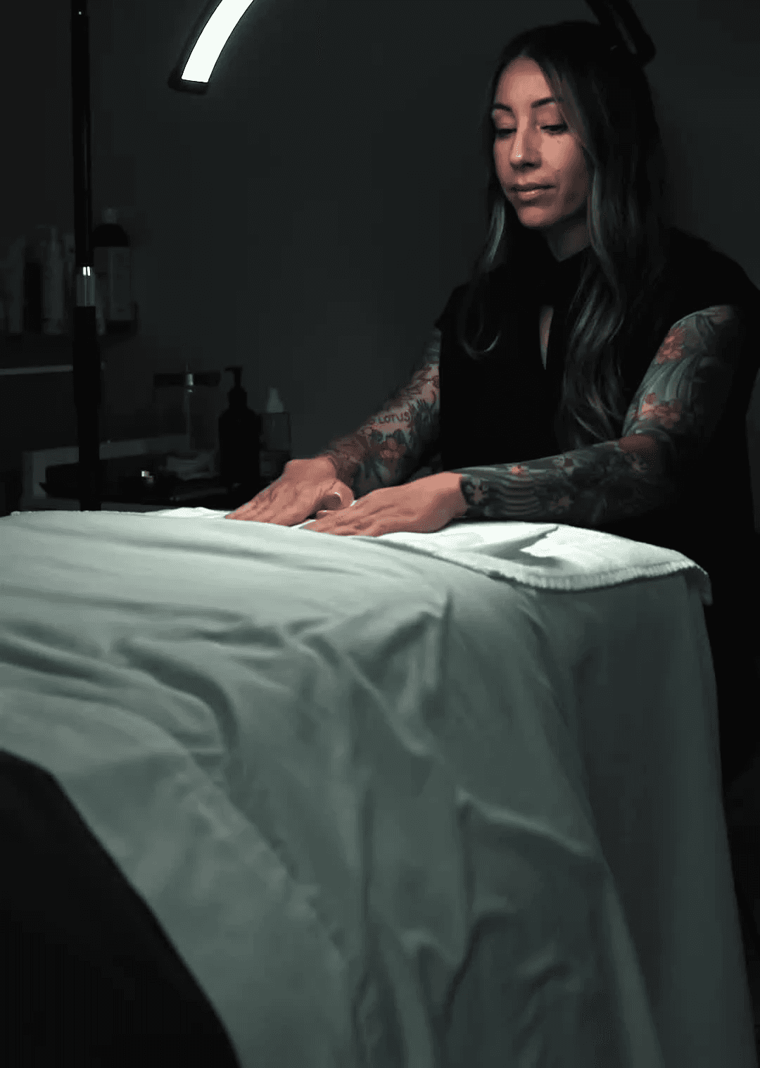 Matsuju working under studio lighting, focused on advanced aesthetic techniques.