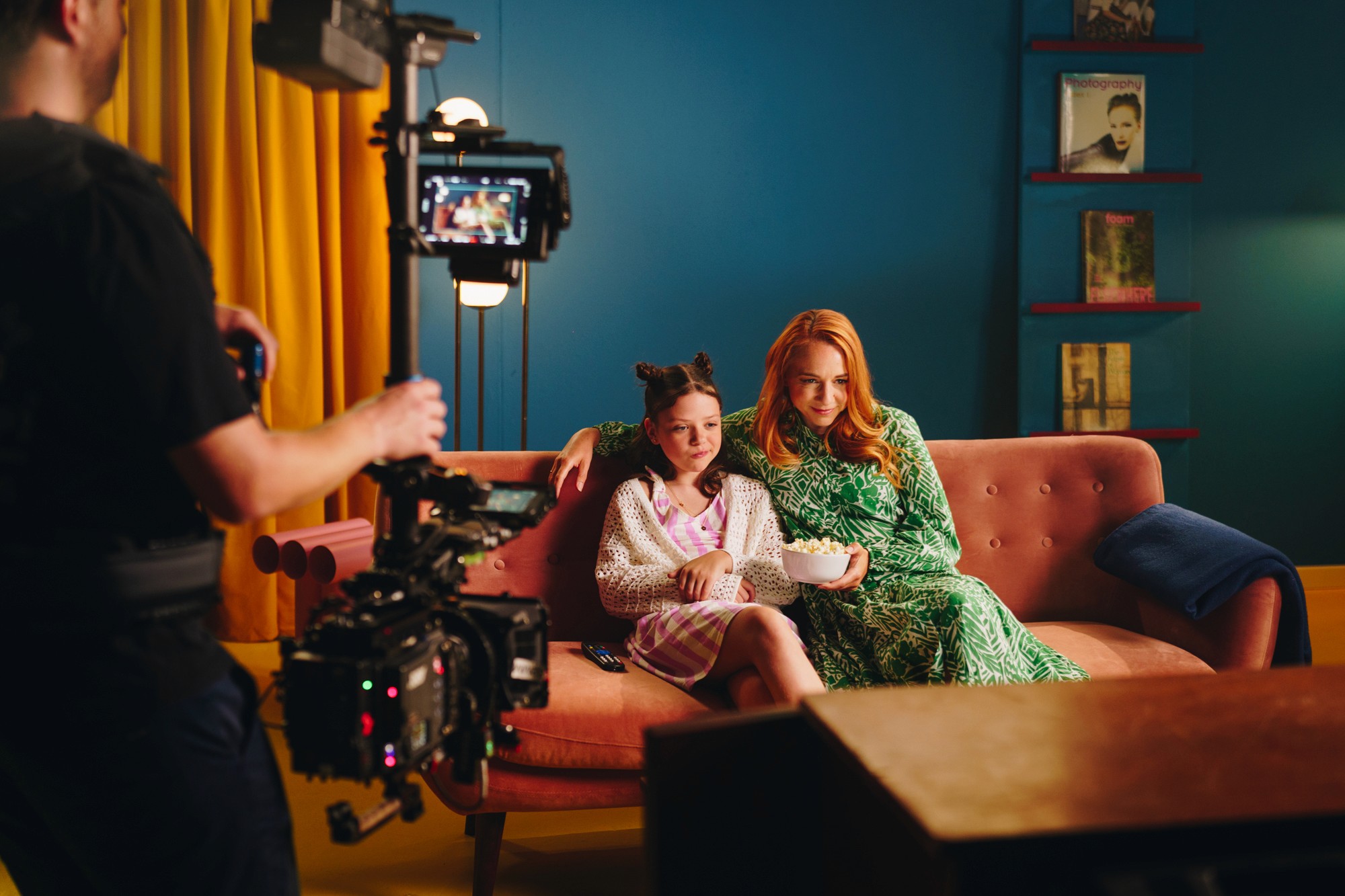 The image captures the ethereal beauty of an underwater cave illuminated by sunbeams penetrating through an opening above.