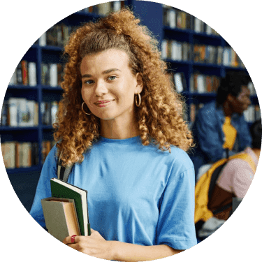 Profile photo of Mia, in a library holding books