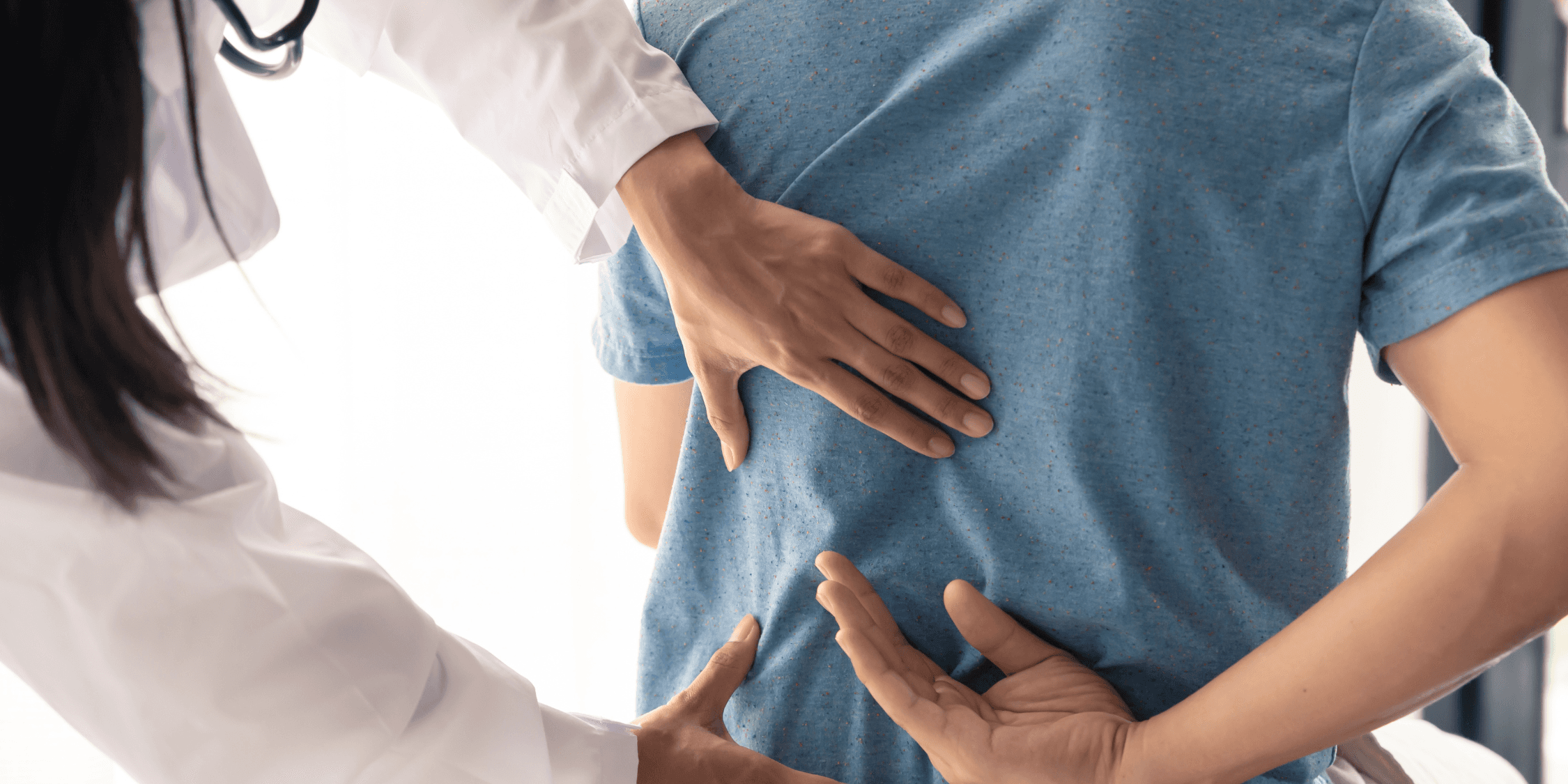 man wearing gray polo shirt beside dry-erase board