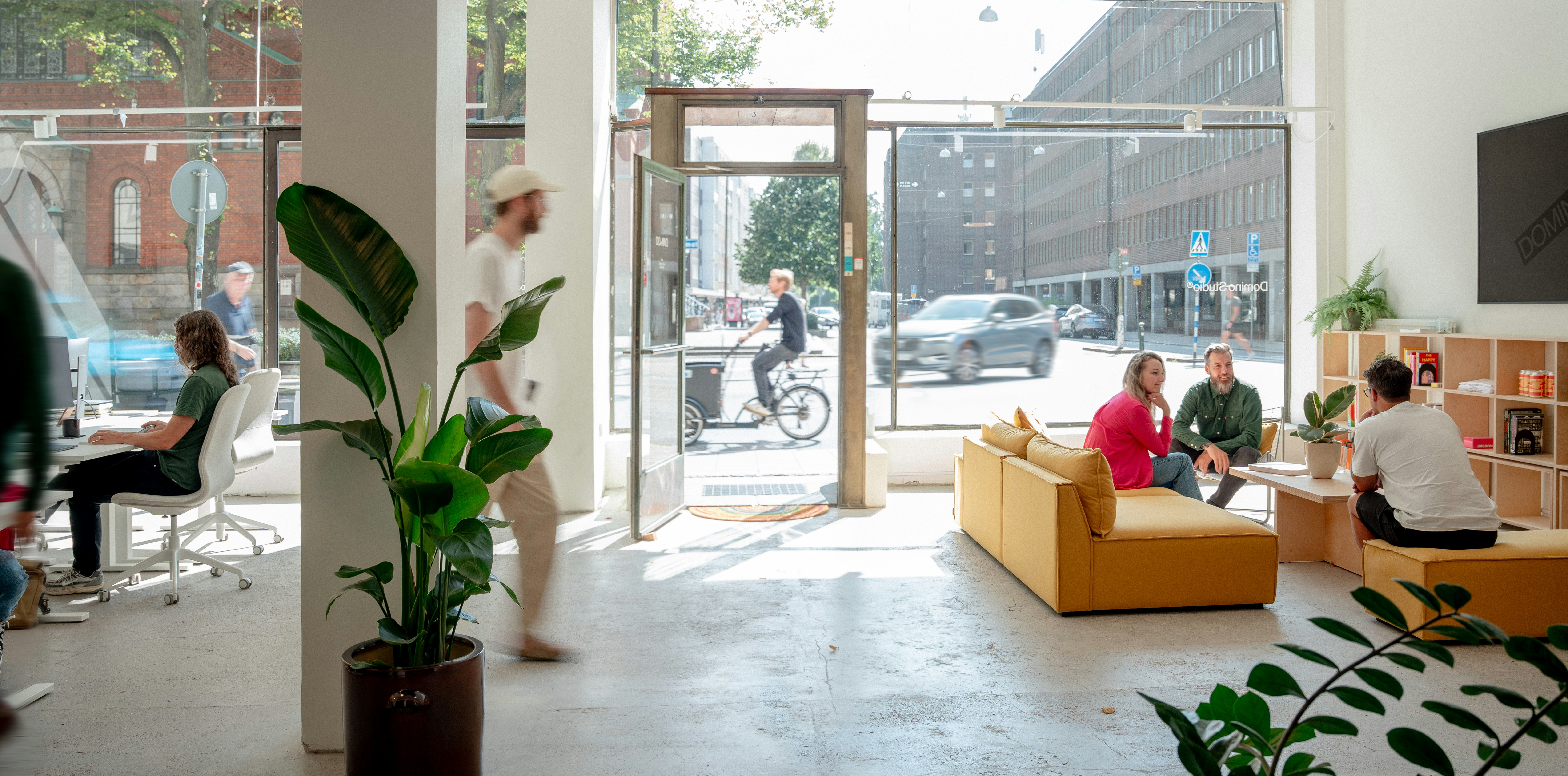 A group of people sitting around a living room