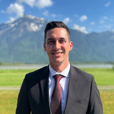 Young man in glasses wearing a black shirt indoors