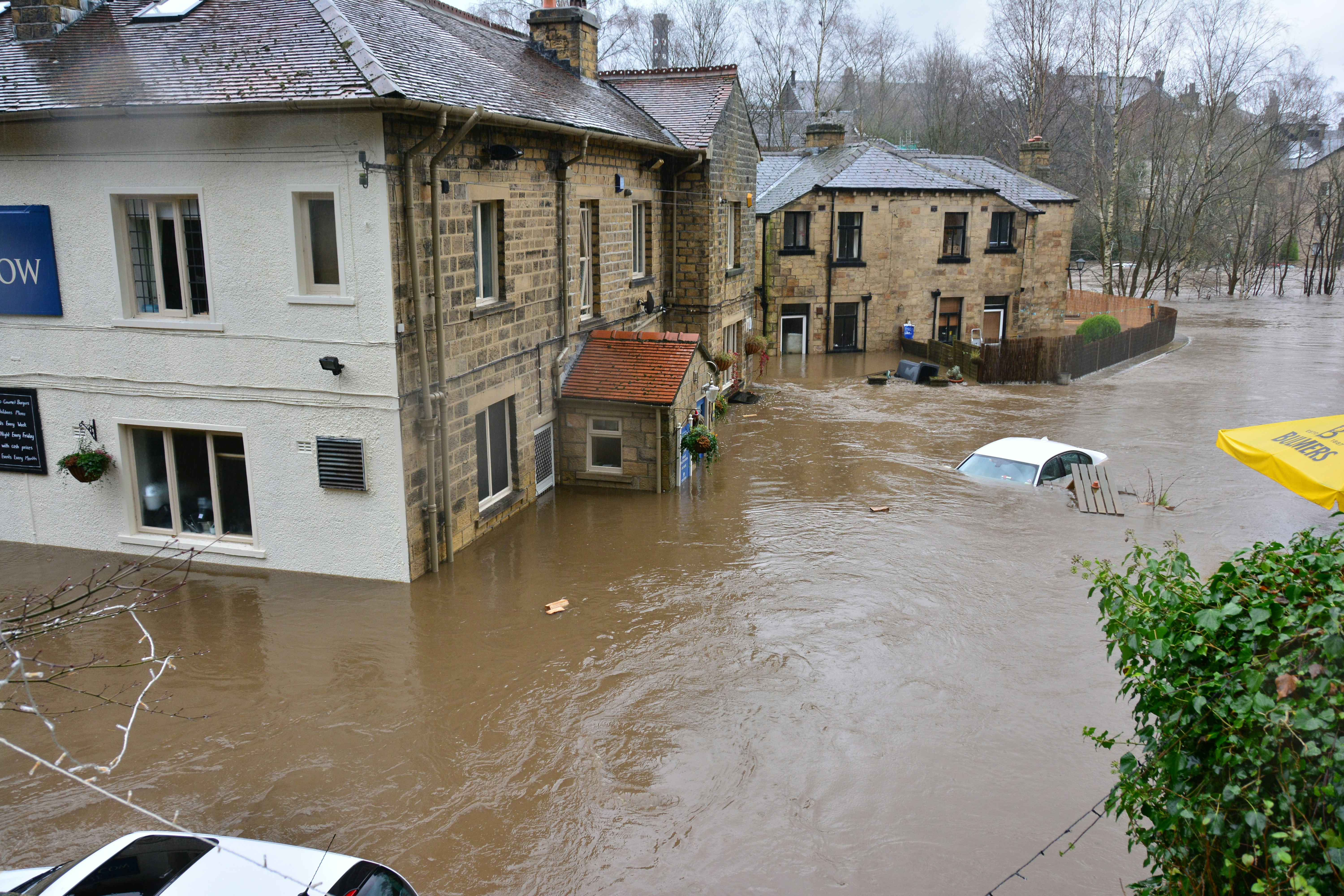 flooded street with cars submerged