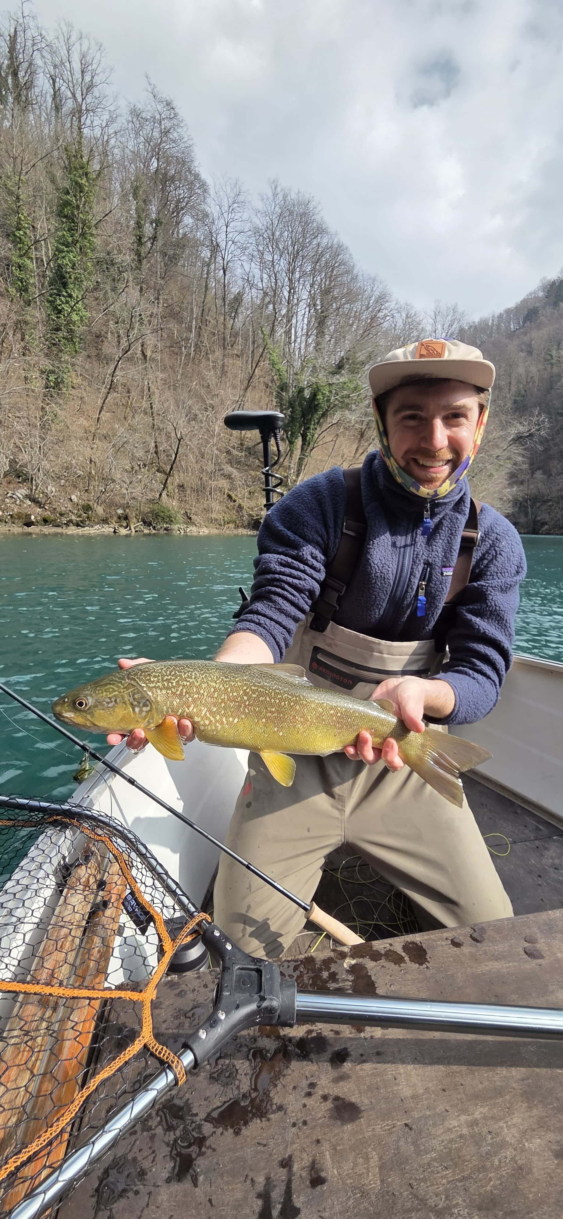 Heavy streamer fishing for marble trout in Slovenia using sinking line from drifting boat