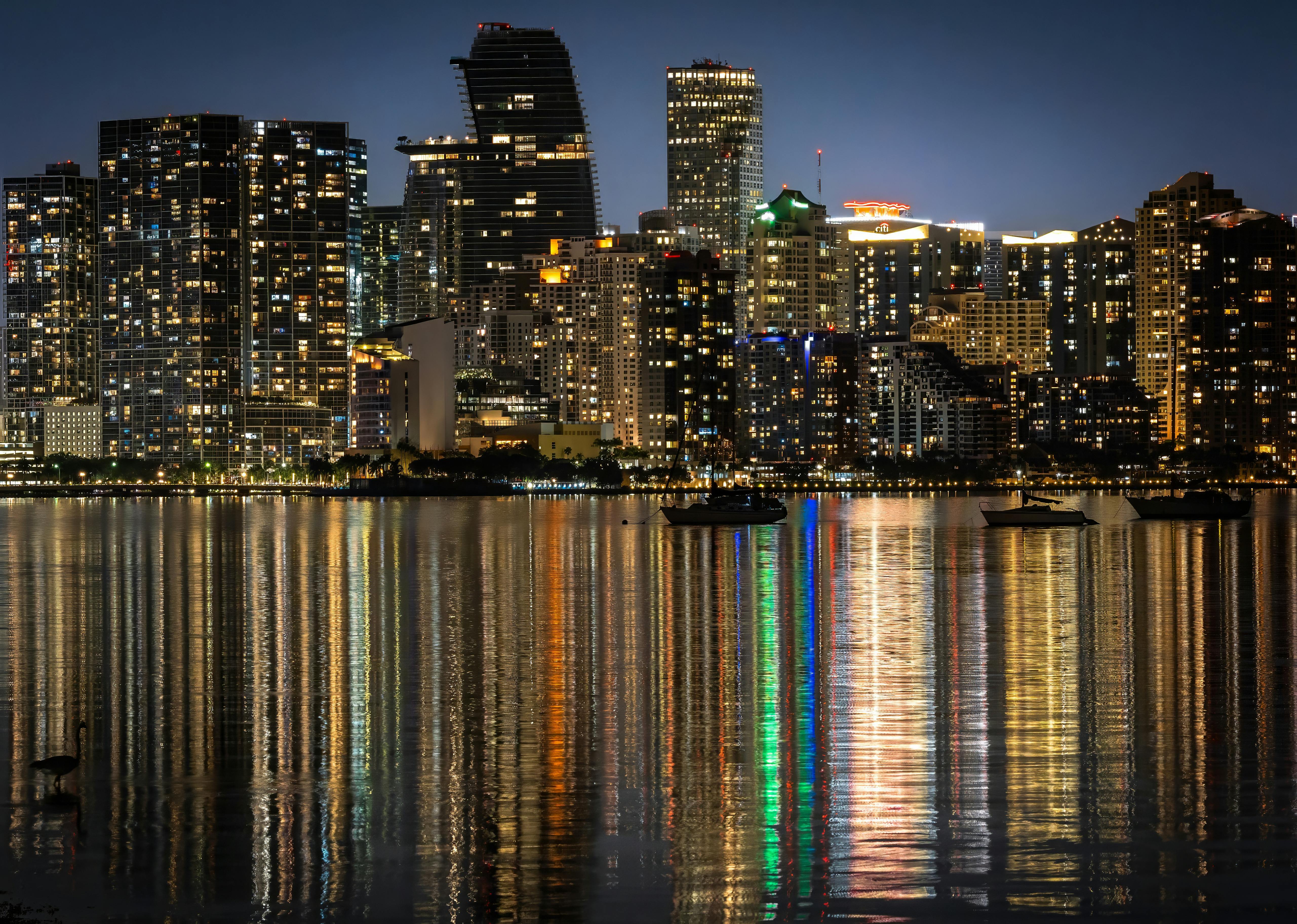 Blurred image of a city skyline with tall buildings.