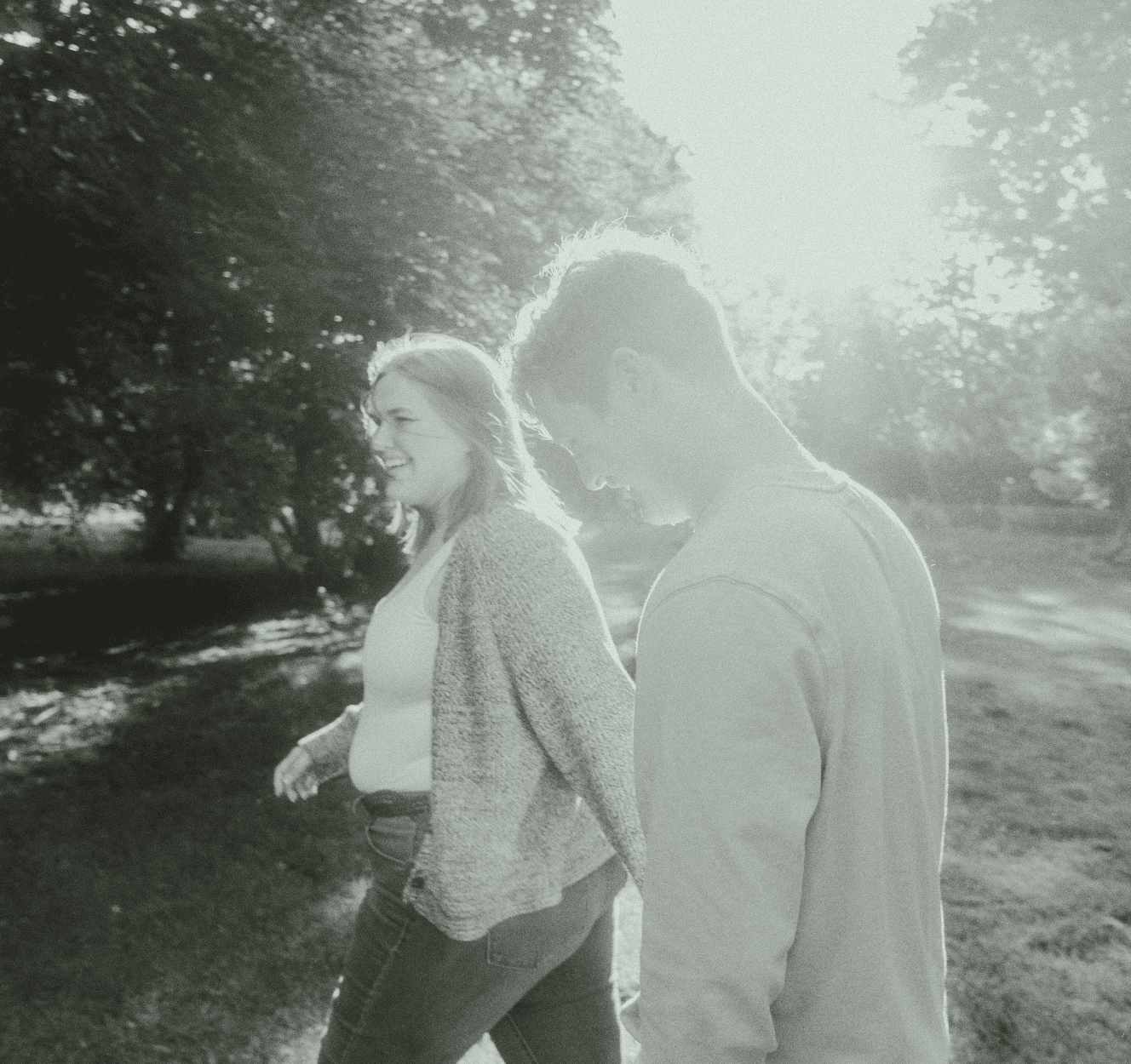Couple walking through a flower garden