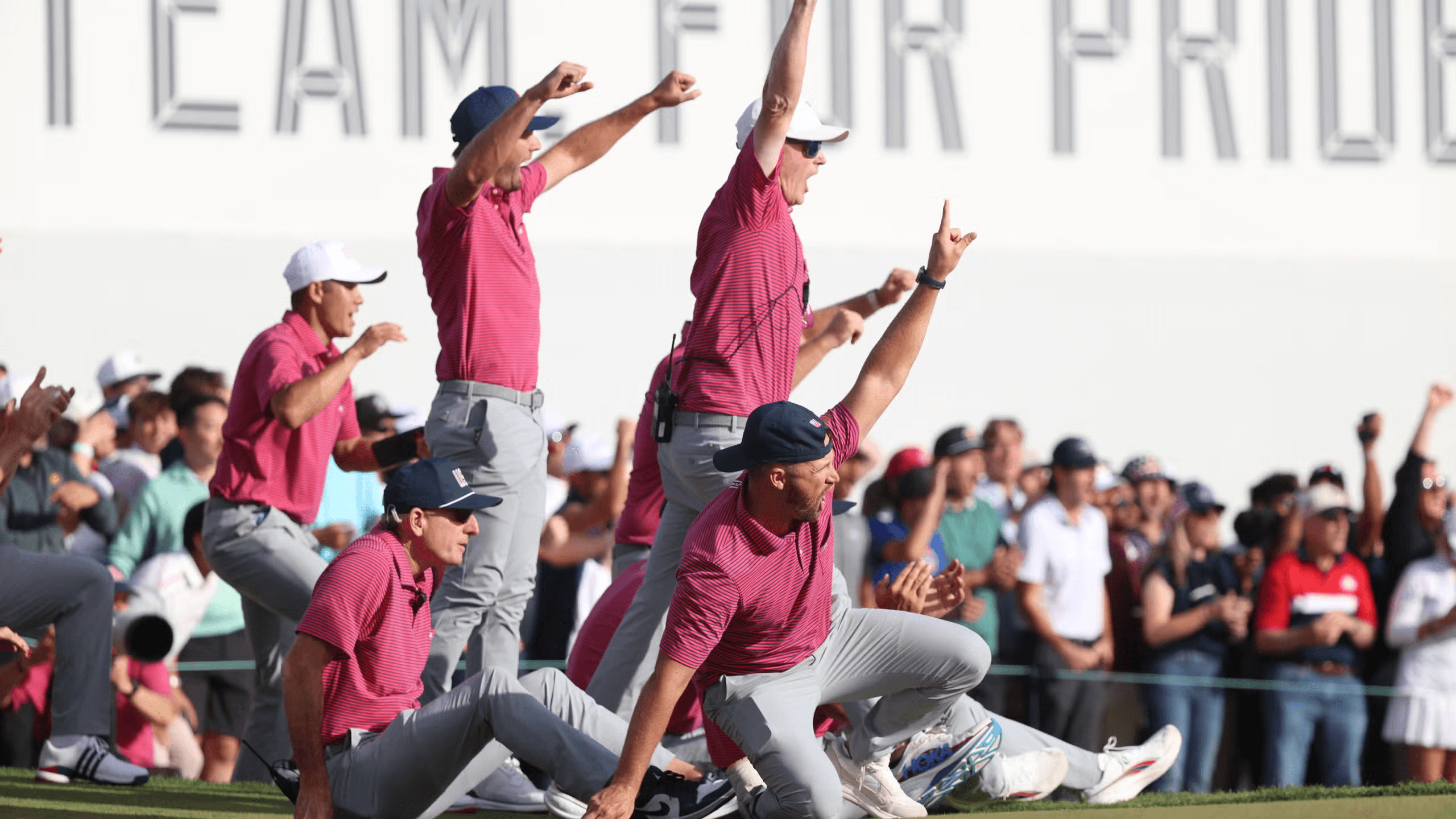 A golfer resetting before the next shot during a high-pressure team competition.