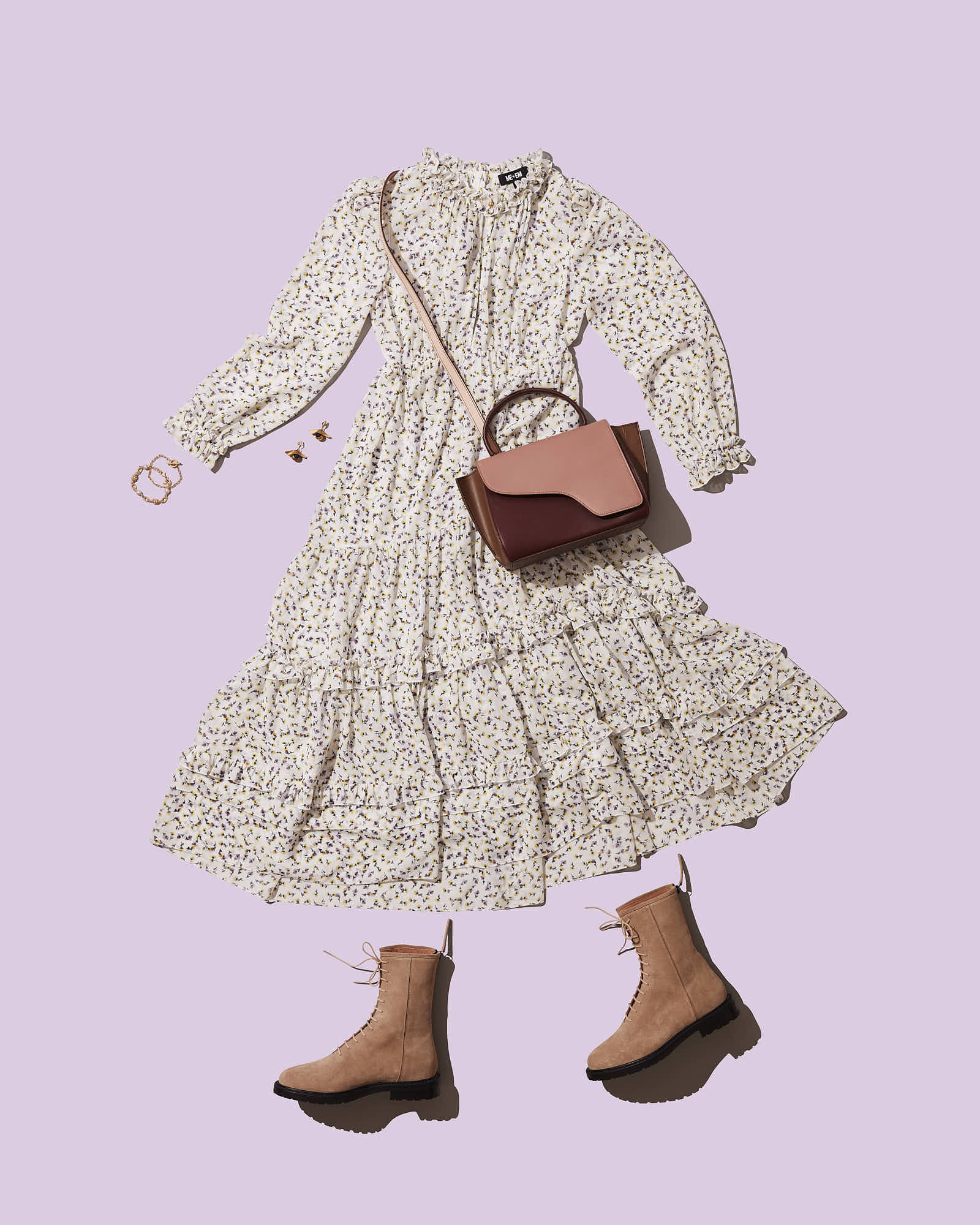 Floral print dress with tan boots and pink handbag flat lay on pastel background.