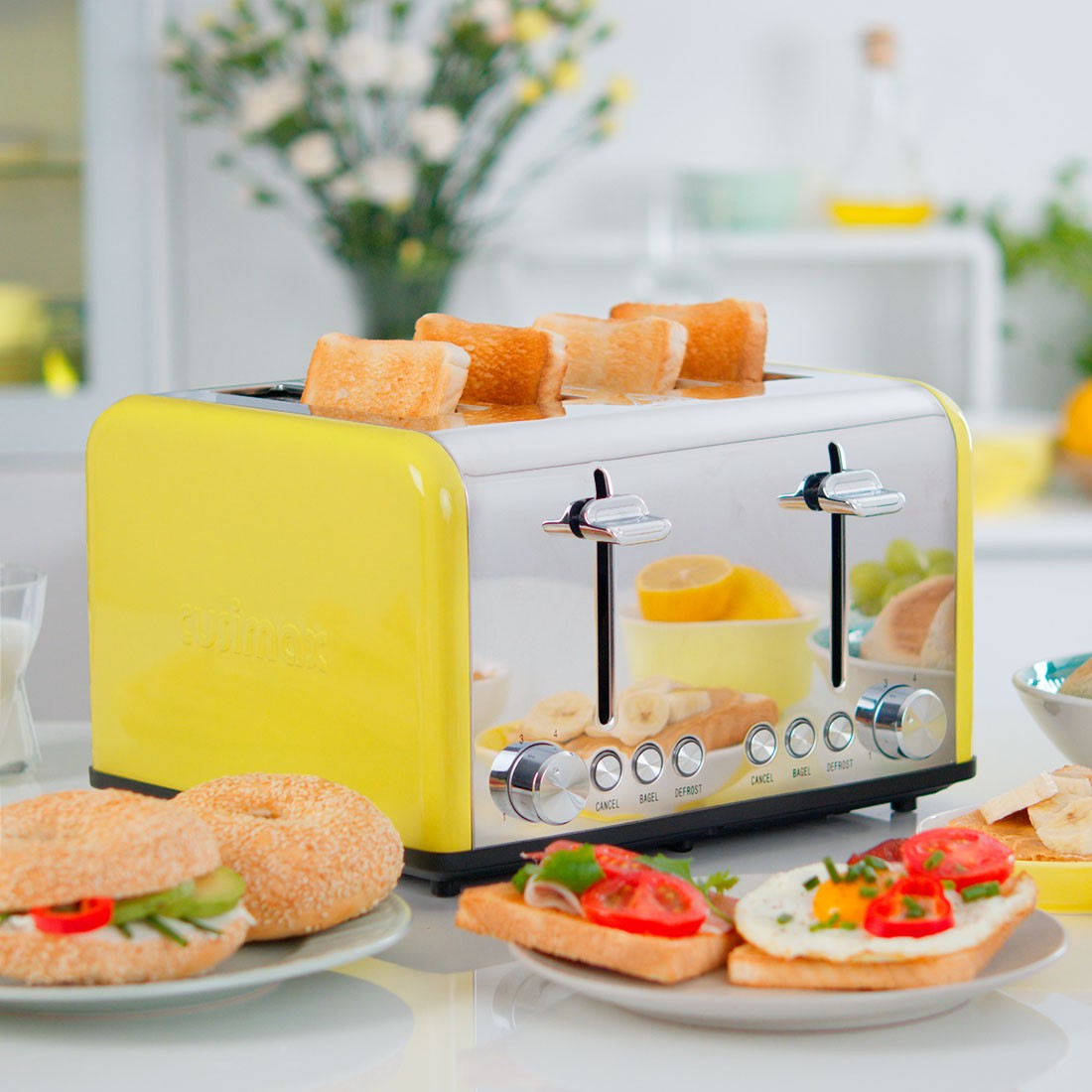 The image features a stylish yellow Cusimax toaster on a kitchen counter, toasting bread slices, surrounded by plates of colorful breakfast items including bagels with cream cheese, and dishes garnished with red tomatoes and green leafy vegetables.