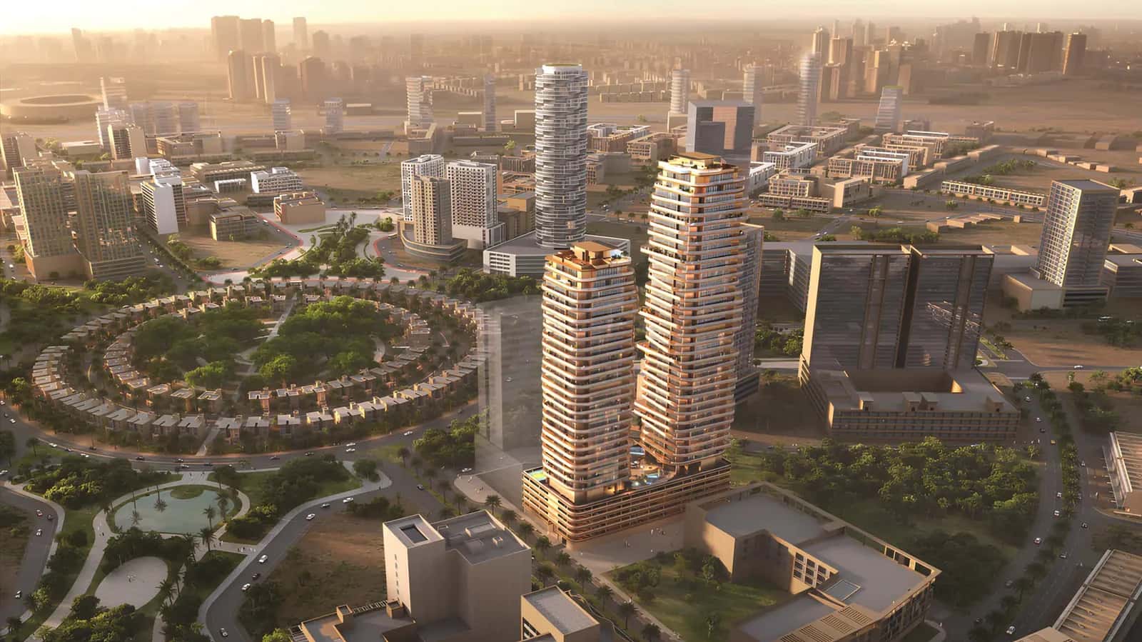 Stax Tower Pasha One, a sleek modern building with glass facade, surrounded by greenery and urban landscape.